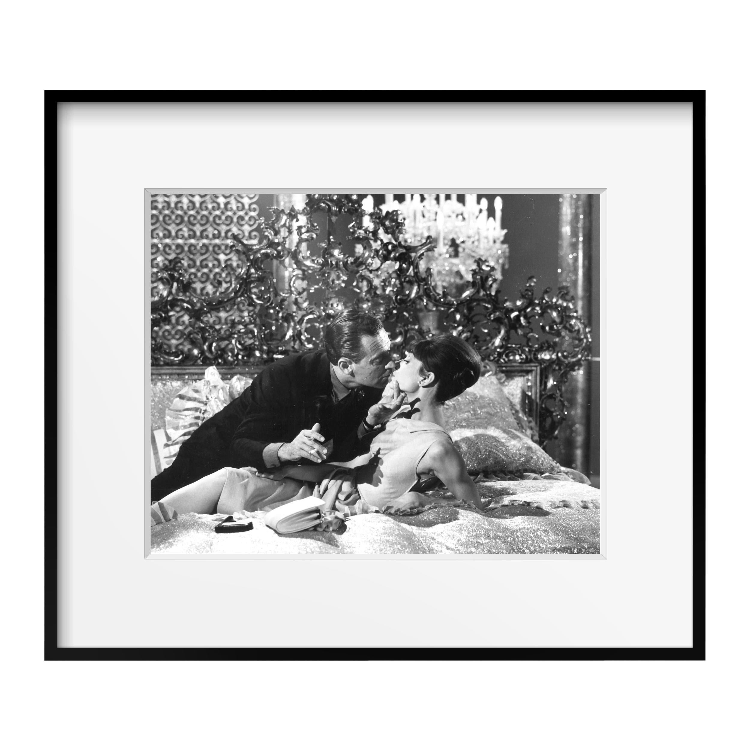 From the Personal collection of Audrey Hepburn, Christie's, September 2017
Audrey Hepburn and William Holden kiss on the set of 'Paris When it Sizzles,' Paris, 1962 by Vincent Rossell
Vintage gelatin silver print
Photographer's credit stamp,