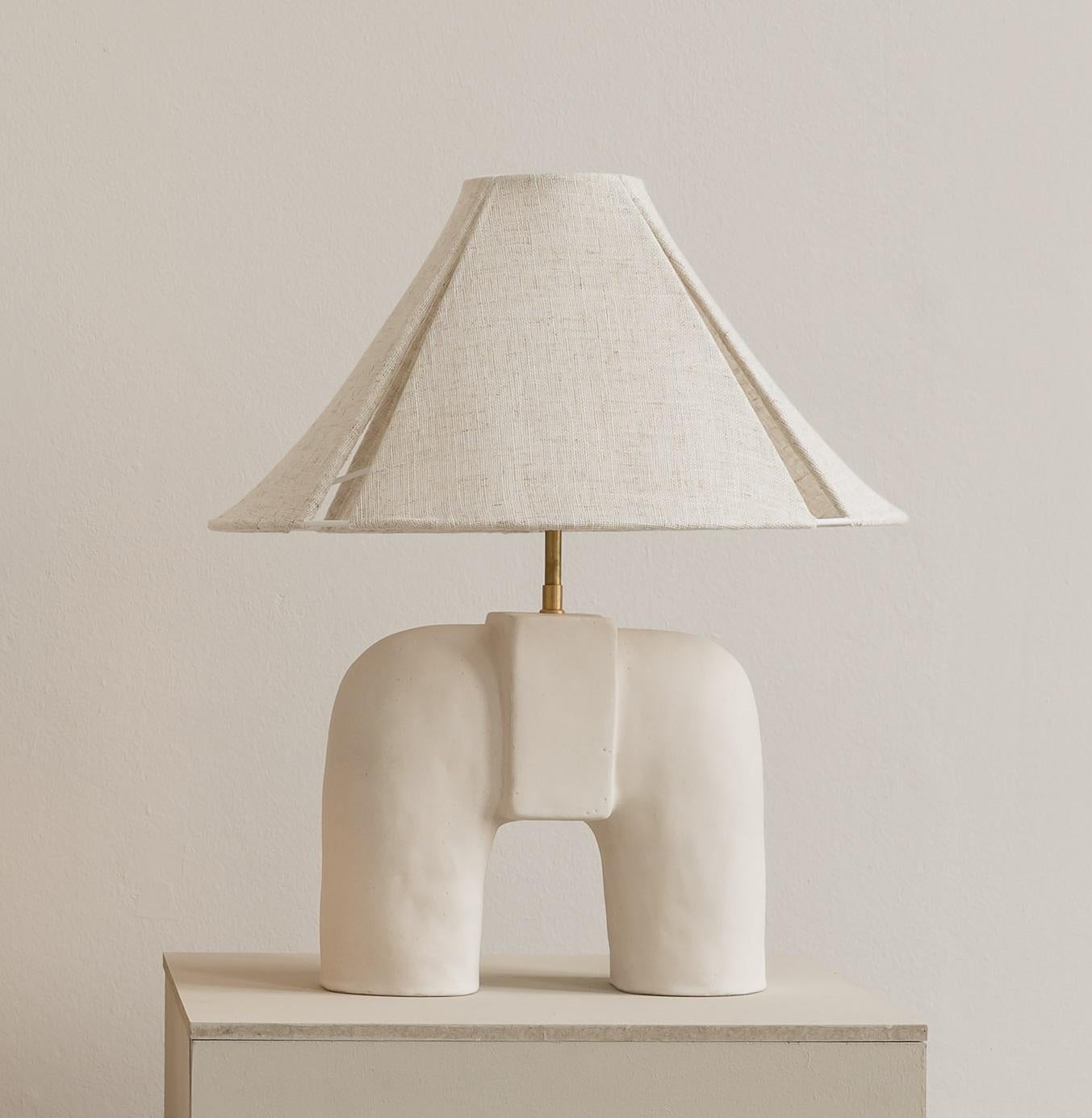 Audrey Table Lamp by Cuit Studio
One of a Kind.
Dimensions: Ø 40 x H 50 cm.
Materials: Stoneware white crackled matt with linnen lampshade.

Due to the handmade process of this item, each piece will be unique and some variation is to be expected.