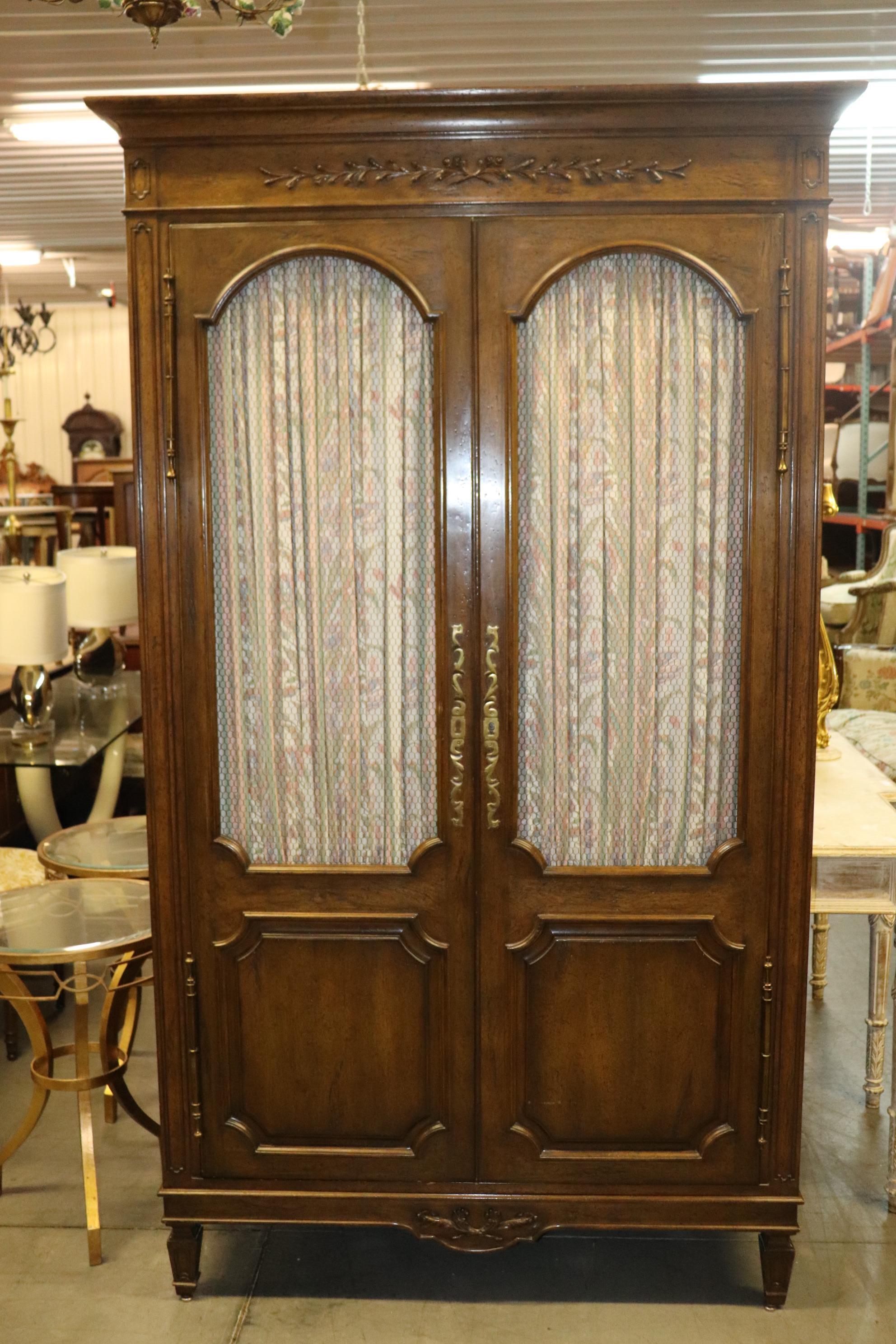This fantastic Auffray and Co of New York Louis XVI armoire has a wonderful design, wire mesh grillwork in the doors for ventilation and is pure in design and needs no explanation. The armoire is in very good vintage condition and measures 89 tall x