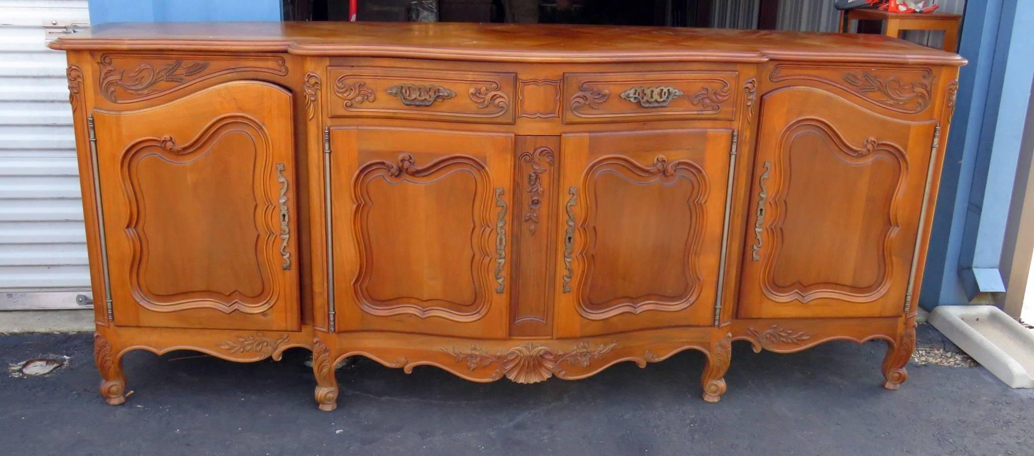 Auffray style sideboard with two drawers over four doors containing five shelves.