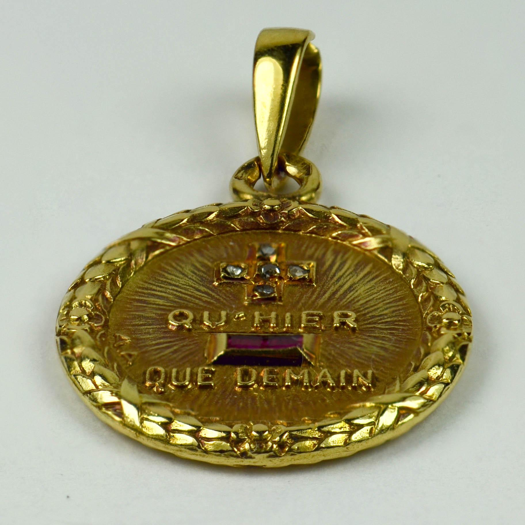 A French 18 karat yellow gold, diamond and ruby love charm pendant with a rebus spelling out 