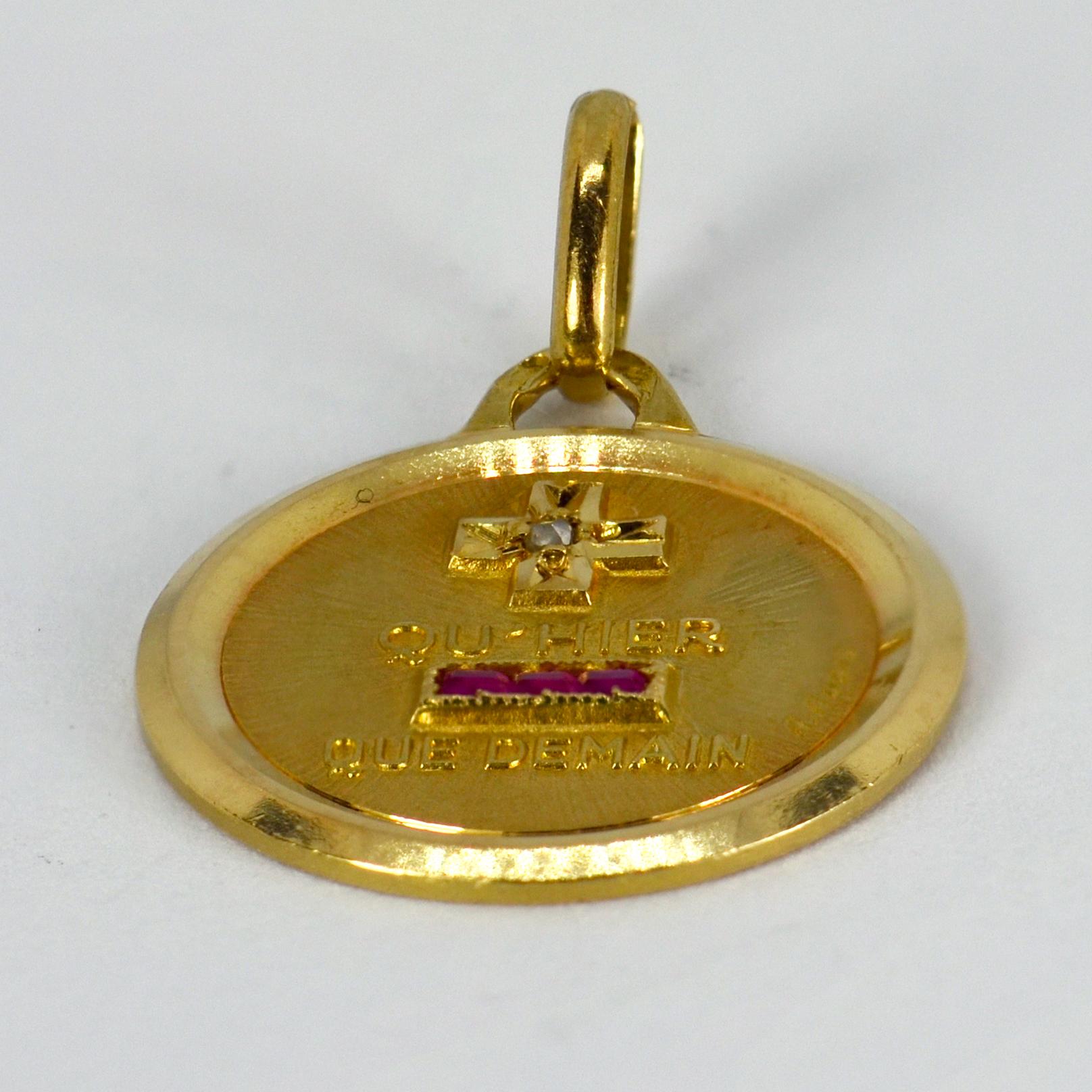 A French 18 karat (18K) yellow gold, diamond and ruby love charm pendant with a rebus spelling out 