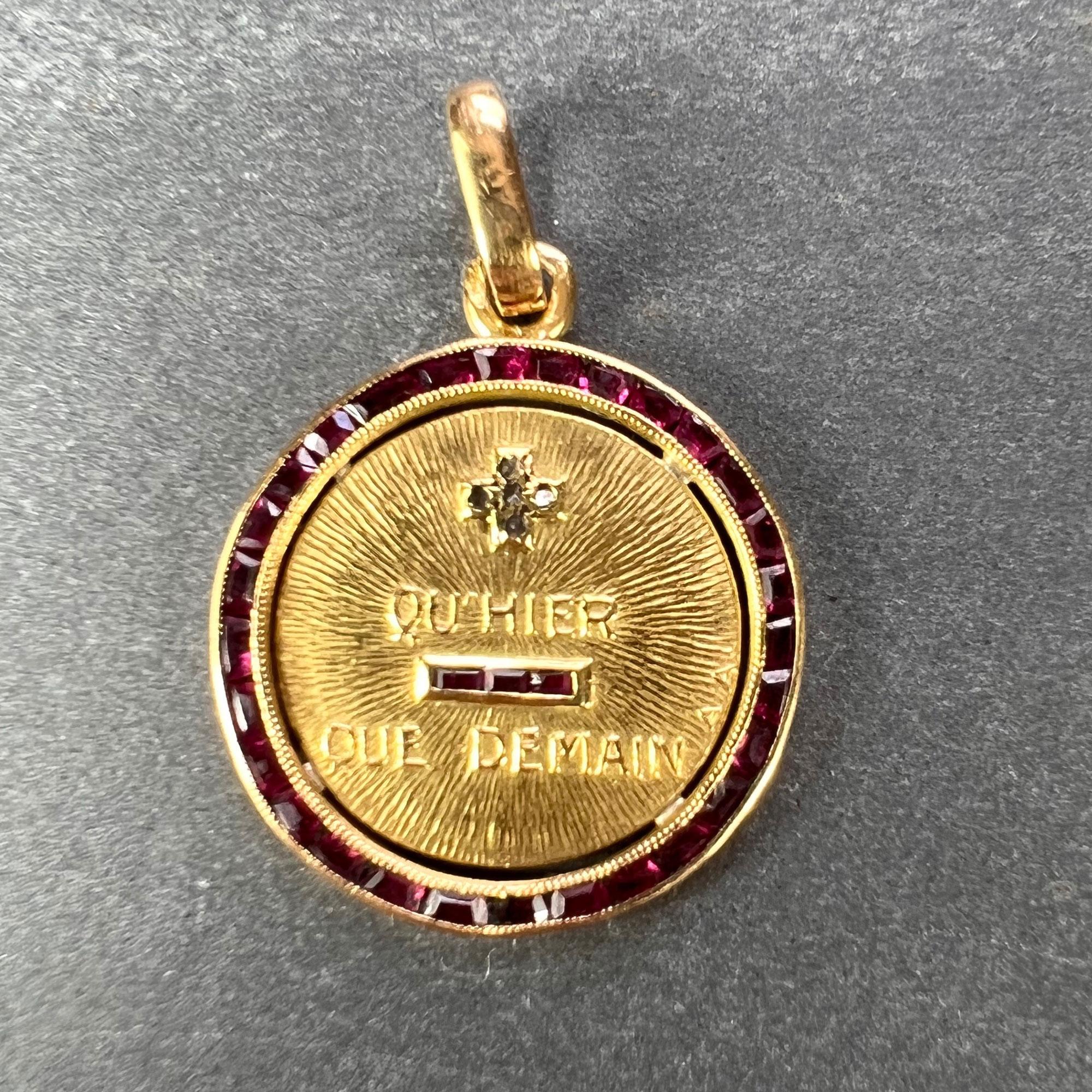 A rare French 18 karat (18K) yellow gold, diamond and ruby love charm pendant with a ruby halo. The rebus spells out 