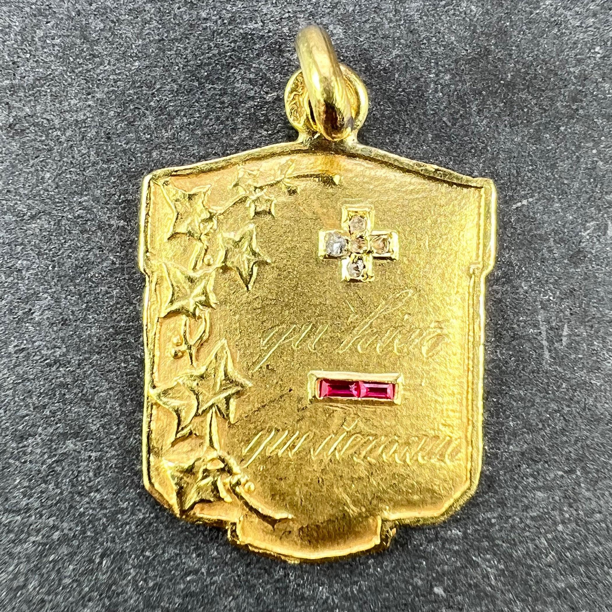 A French 18 karat (18K) yellow gold, diamond and ruby love forever charm pendant with a rebus spelling out 