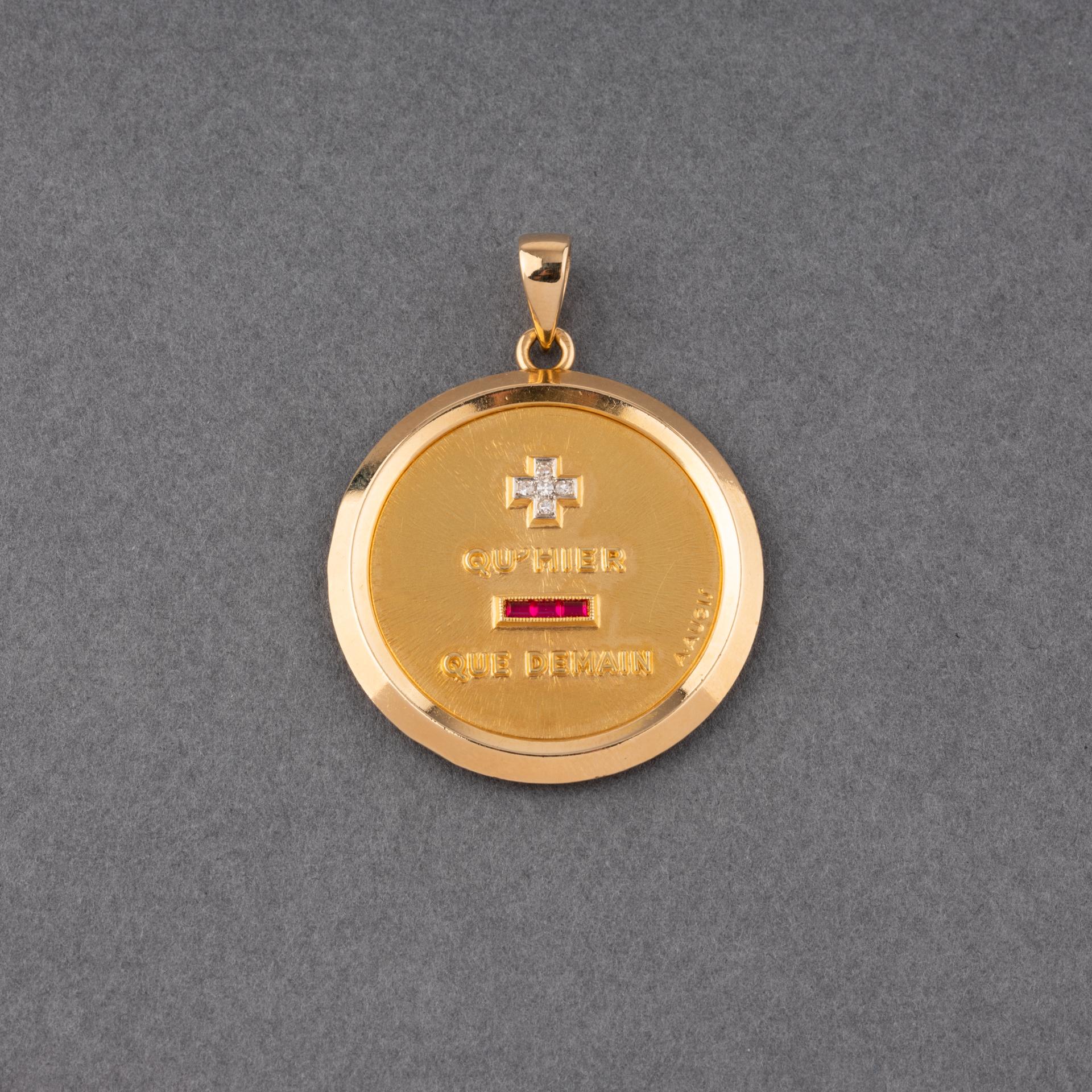 A very lovely vintage medal, made by French house AUGIS. 
It is an unusual model, they are generally smaller and lighter.
Made in yellow gold 18k, set with diamonds and red stones.
Dimensions: 33 mm diameter. 
Weight: 19.20 grams
