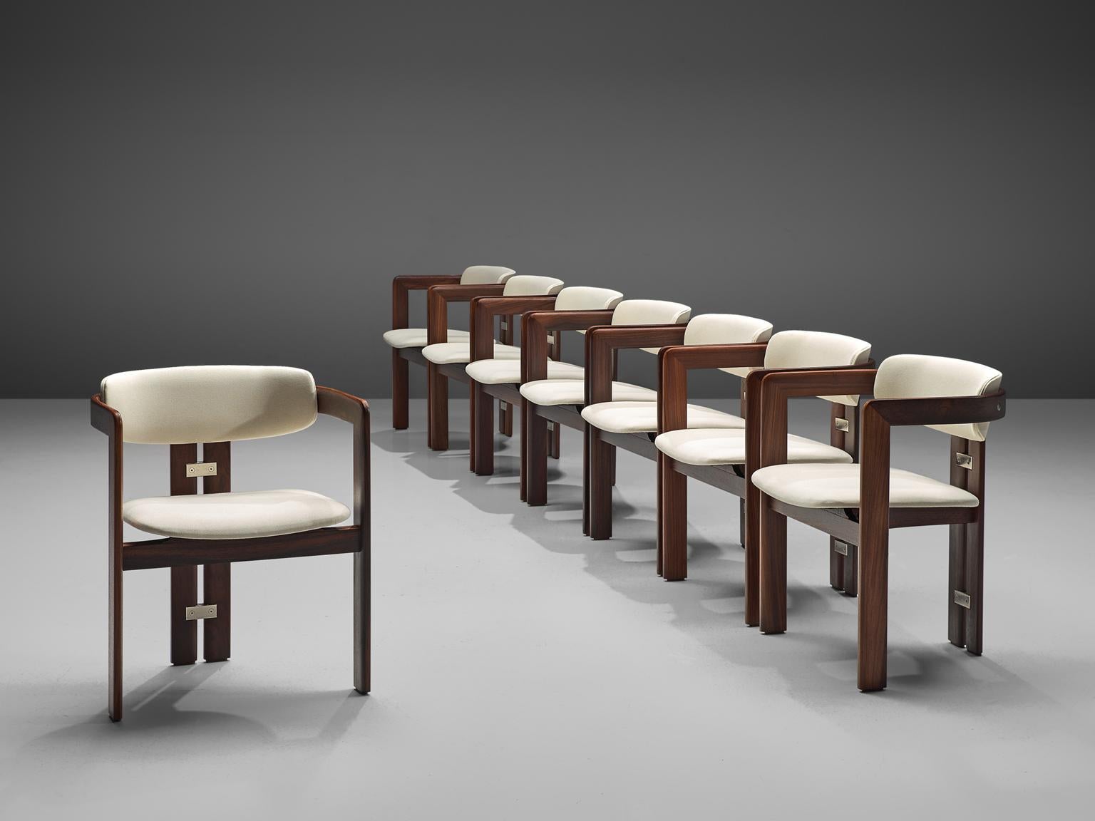 Augusto Savini for Pozzi, set of ten 'Pamplona' dining room chairs, to be reupholstered, glossed wood and metal, Italy, 1965. 

Set of six armchairs in dark glossed rosewood and white fabric upholstery. The chairs have a unique and characteristic