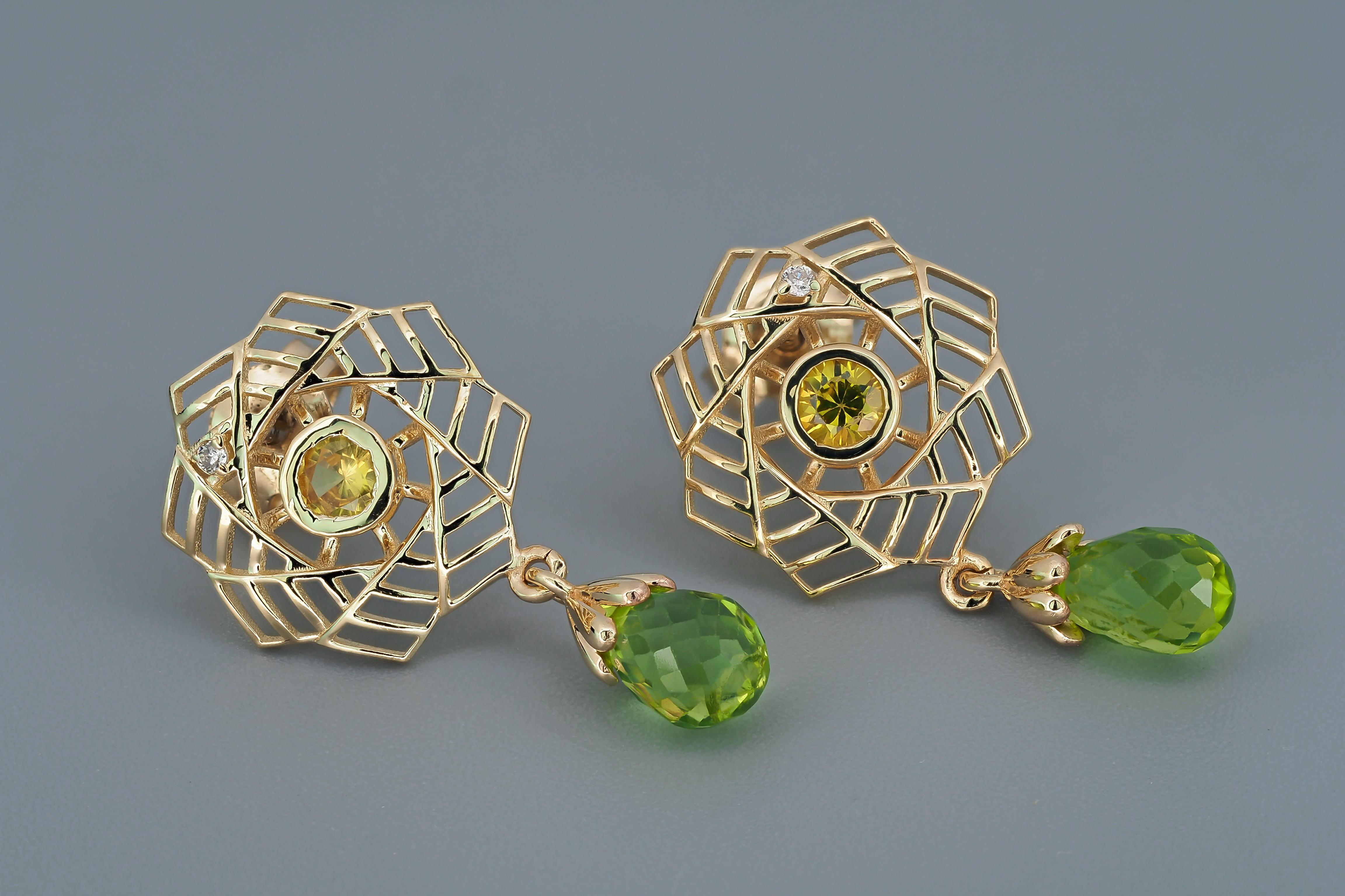 14k gold earrings with peridots, sapphires and diamonds. 
Peridot earrings in 14k gold. Yellow sapphire studs. Briollette peridot earrings.

Material: 14k gold
Weight: 2.80 g.
Earrings size: 25 x 14 mm.

Peridots:
2 pieces, green - color, briolette