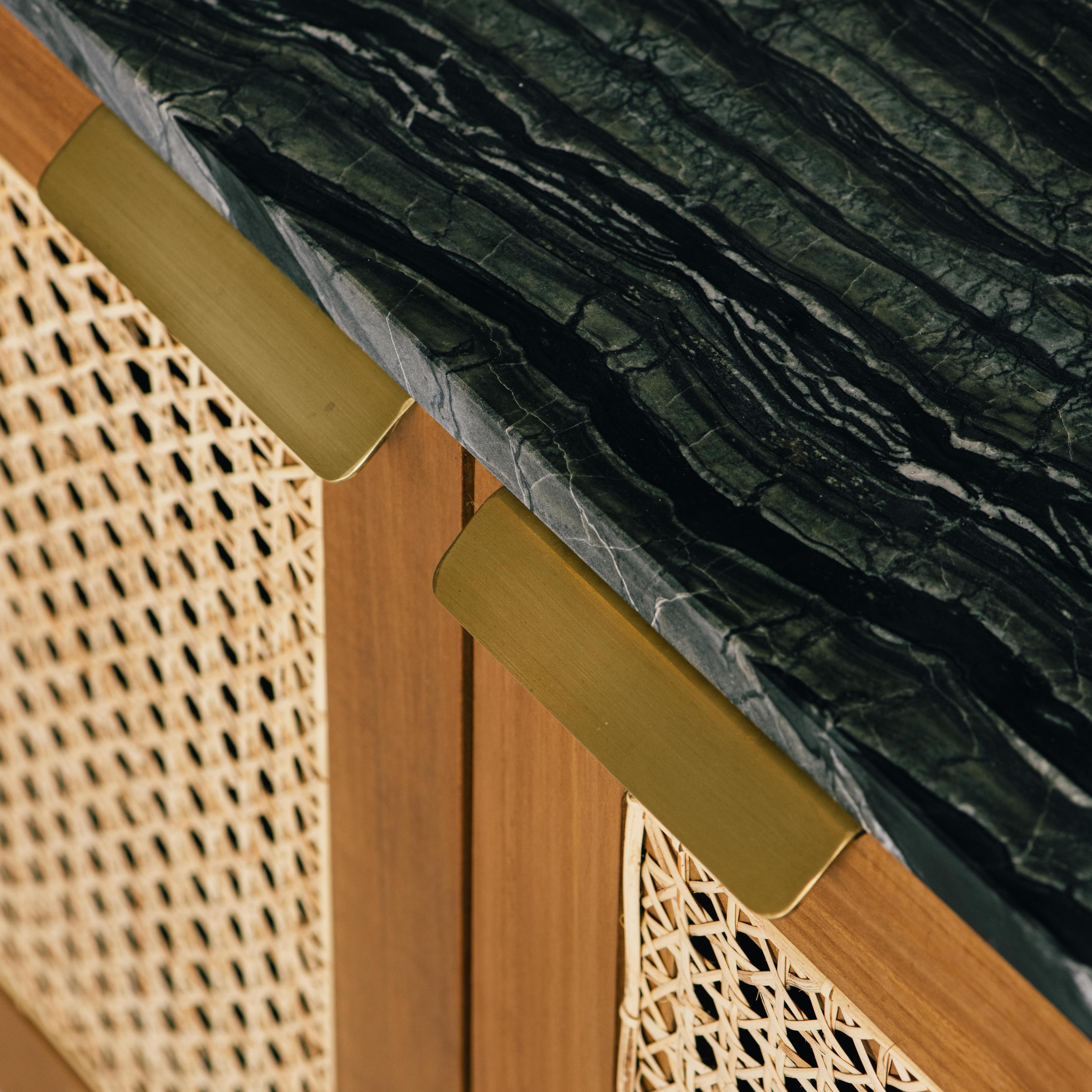 The August Cabinet is the culmination of intricate and intentional design made to bring together the best of our ethically sourced, hand-treated materials. The marble counter sits atop a solid teak timber body that is brought to life by brass