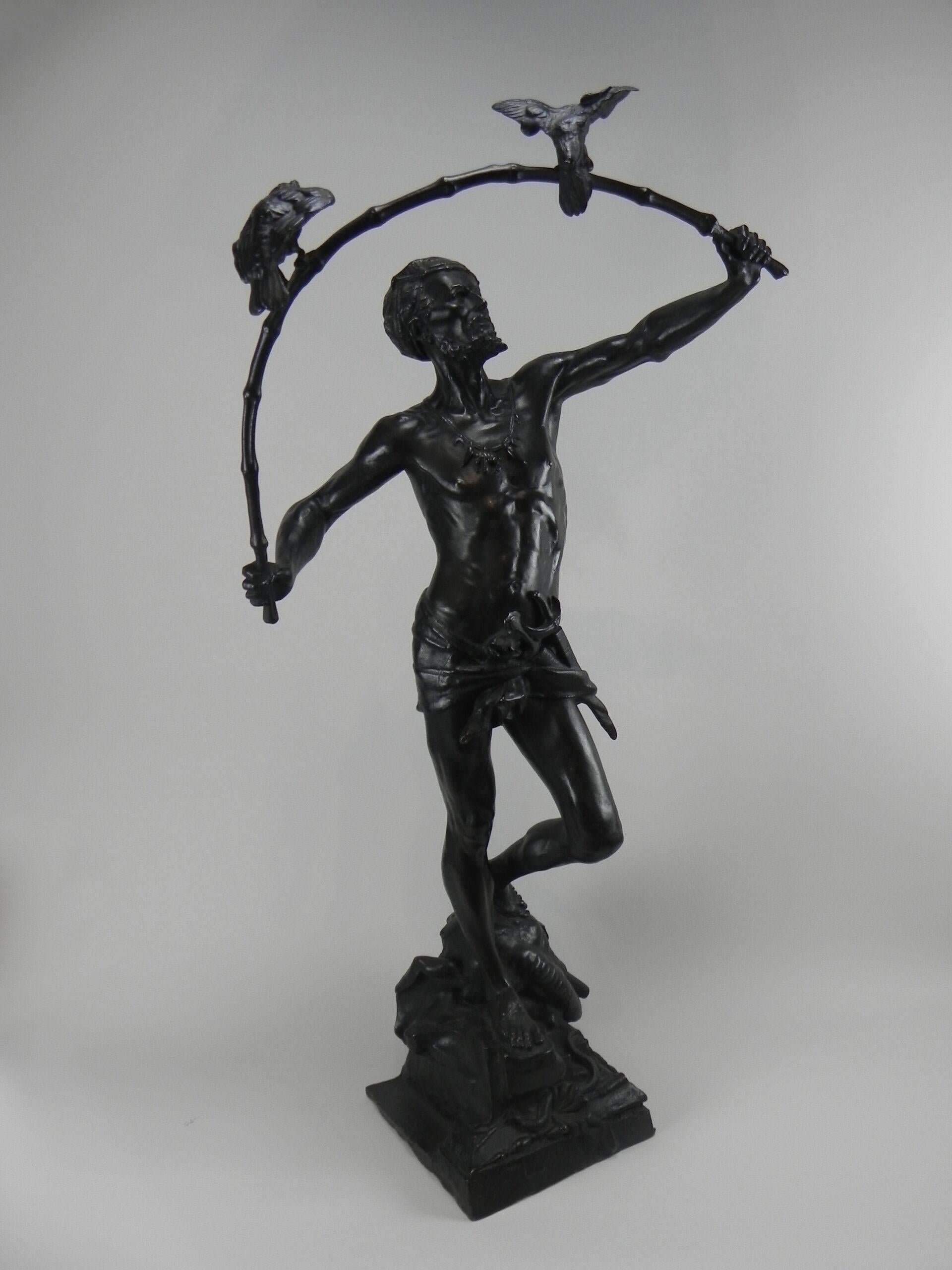 Hindu Birdcatcher
A fine quality, a nineteenth-century bronze cast of the Hindu bird-catcher standing on an elephant skull and holding two birds in the air which are sitting on a bambu stick by Auguste De Wever (Belgian 1836-1910). Old cast probably