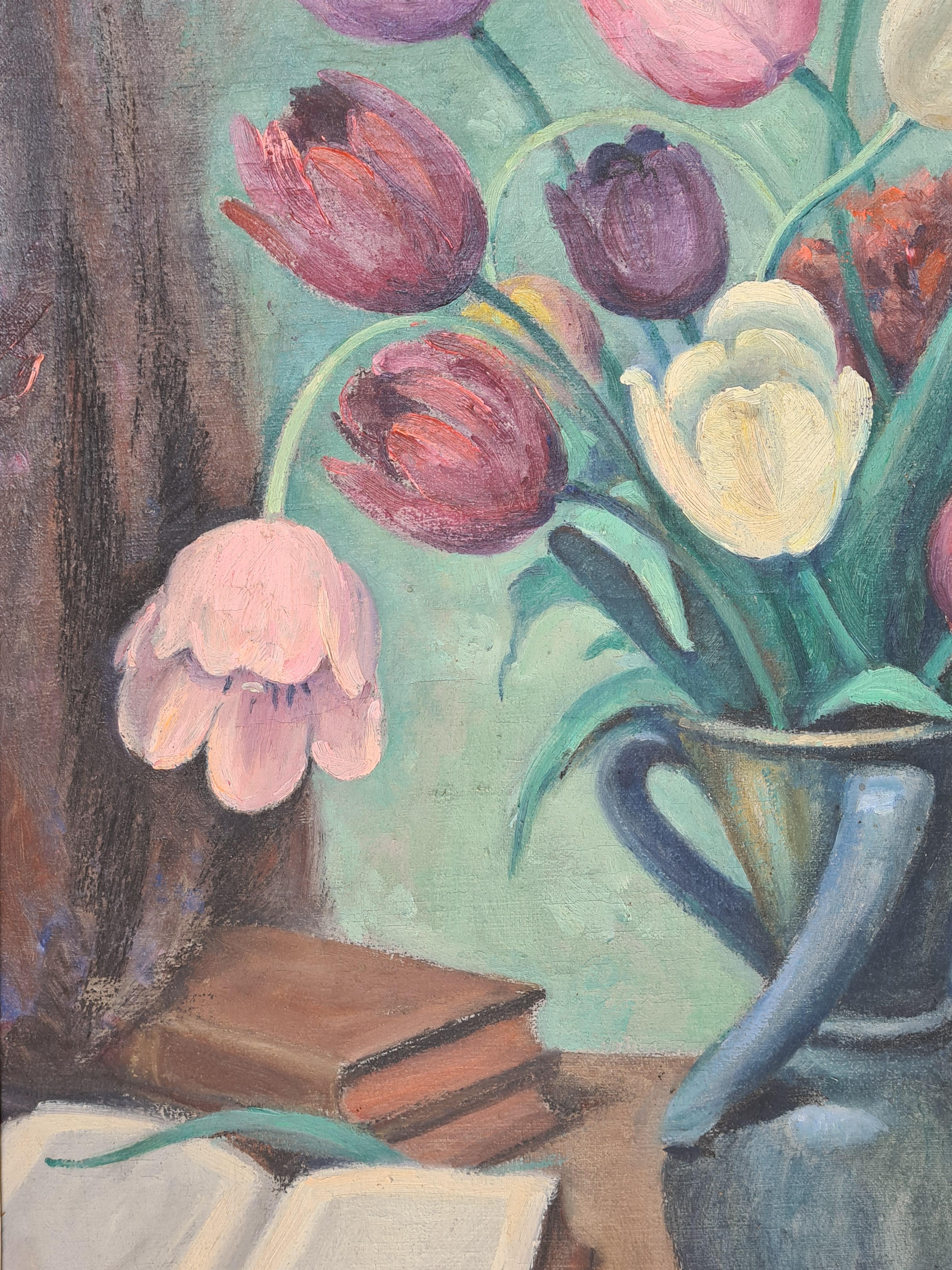 French Art Deco still life of a vase of tulips in an interior by Auguste Mallard. The painting is signed bottom right and presented in a period patinated wood frame.

A colourful and strong painting of an interior view, a table with books and as the
