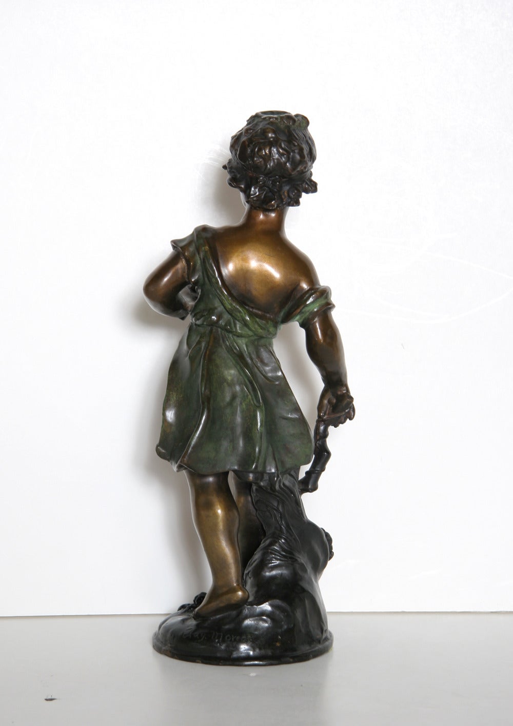 This bronze sculpture by Auguste Moreau is a beautiful work from the Romanticism period. Auguste was the third son of sculptor and painter Jean Baptiste Moreau.  In 1861, he made his debut at the Salon, where he would exhibit regularly until