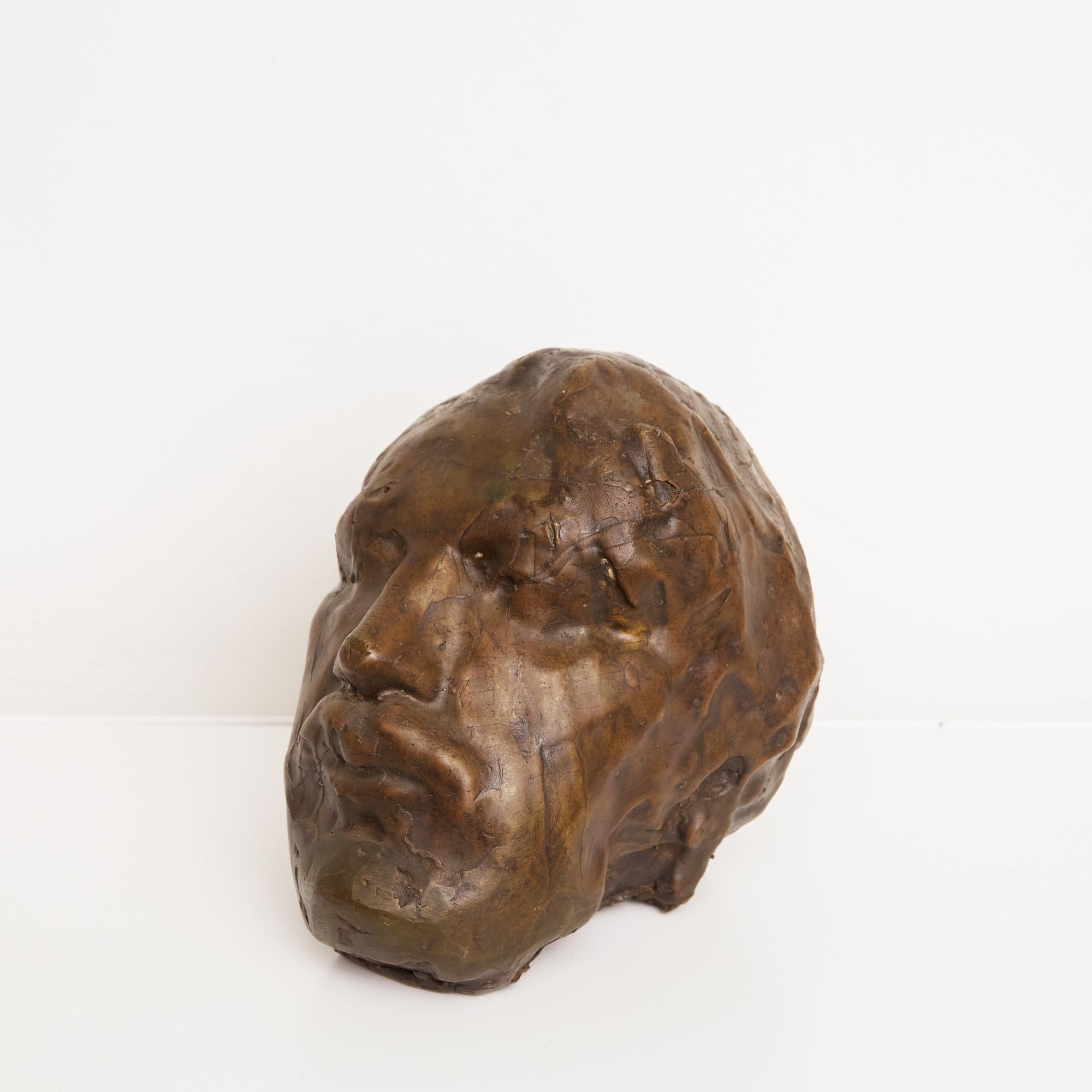 Auguste Rodin style cast bronze head sculpture. The form uses the lost wax bronze method to capture the details of a man's head and facial features. It would look great set atop a pedestal or on a shelf or table displaying unique