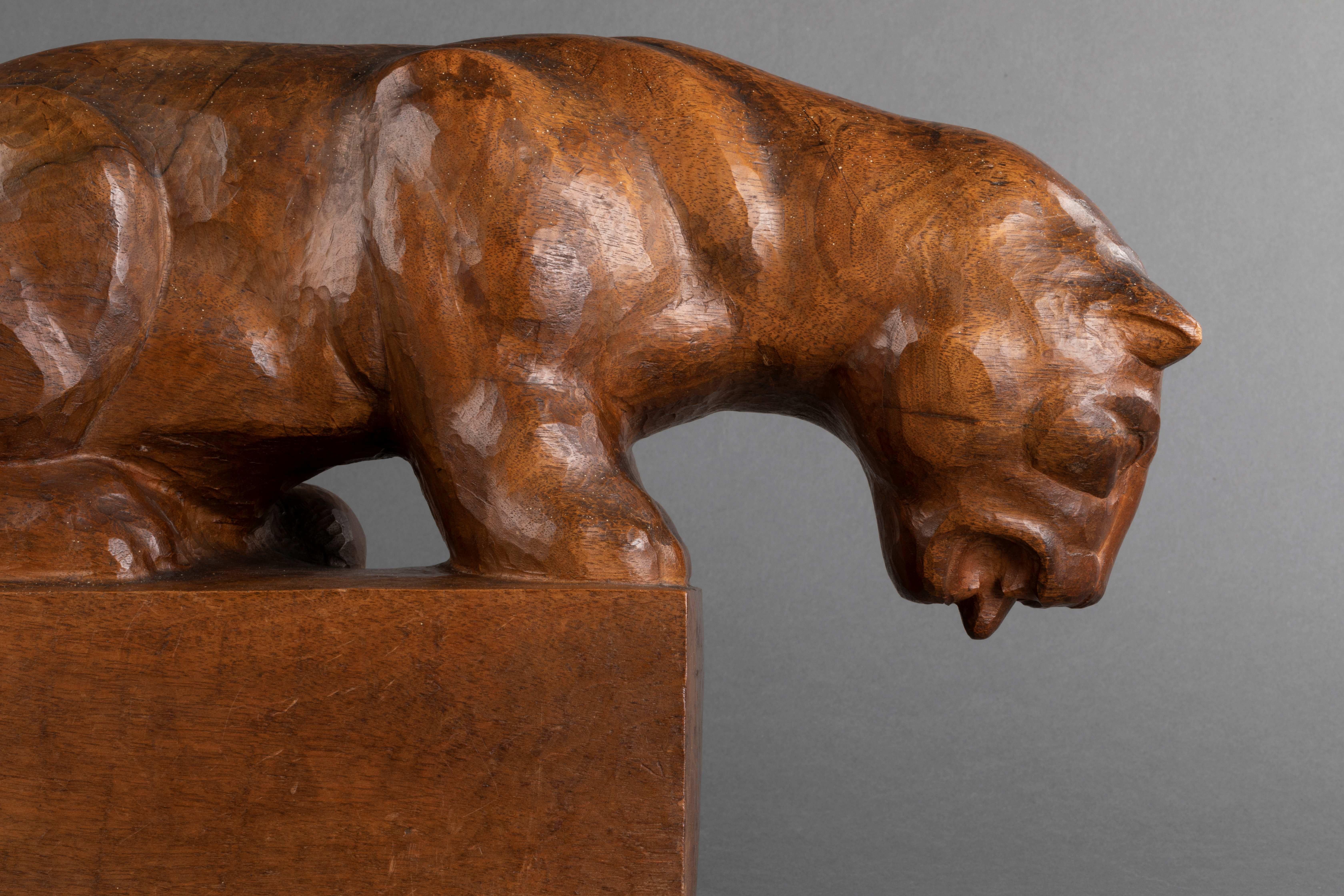 Wood Auguste Trémont(attrib.) : Lion cub drinking, carved wood sculpture c.1950 For Sale