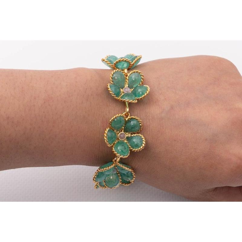 Augustine - Flower bracelet in golden metal and green glass paste.

Additional information:
Condition: Very good condition
Dimensions: Length: 18.5 cm to 20 cm (7.28