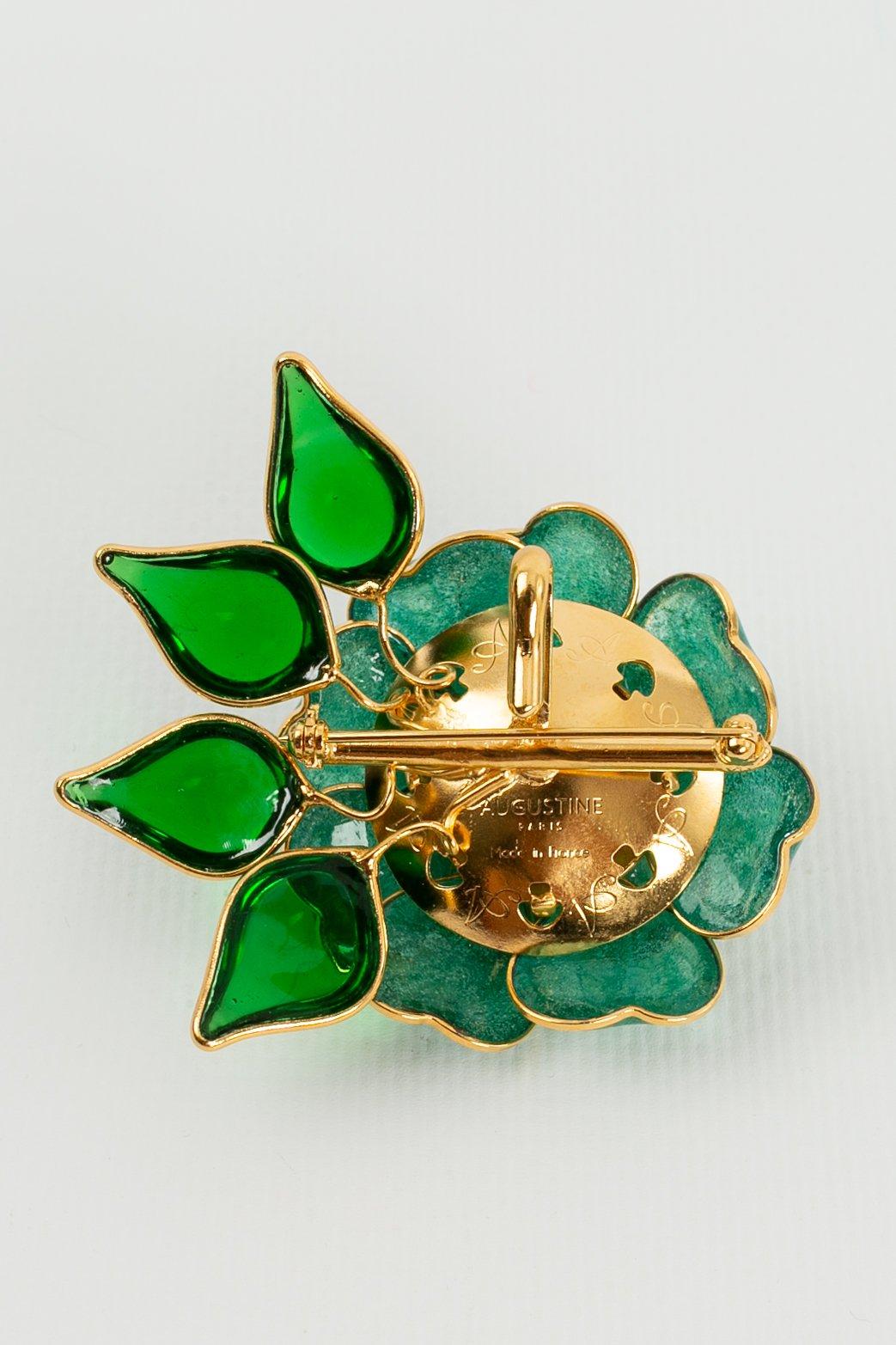 Augustine - (Made in France) Camellia brooch/pendant in gilded metal and green glass paste. Signed at the back.

Additional information:
Condition: Very good condition
Dimensions: Height: 4 cm (1.57