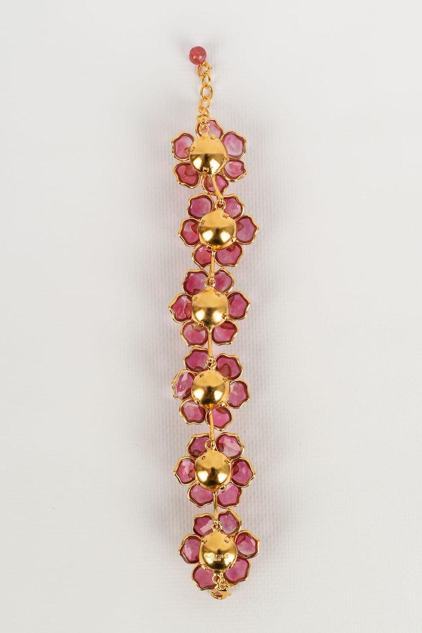 Augustine - Golden metal and glass paste bracelet in shades of pink.

Additional information:
Condition: Very good condition
Dimensions: Length: from 19 cm to 21.5 cm

Seller Reference: BRA132