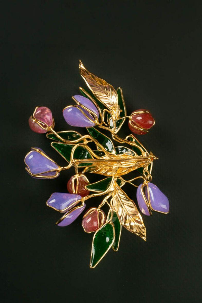 Augustine (Made in France) Gilded metal brooch representing flowers in mauve, red, and green glass paste.

Additional information:

Dimensions: 
Height: 8.5 cm (3.34