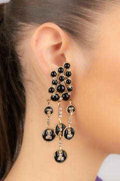 Augustine Golden Metal Earrings with Black Glass Paste