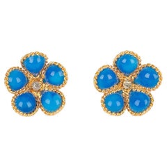 Boucles d'oreilles Augustine Fleur en métal doré avec pâte de verre bleue et strass