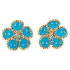 Boucles d'oreilles Augustine Fleur en métal doré avec pâte de verre bleue