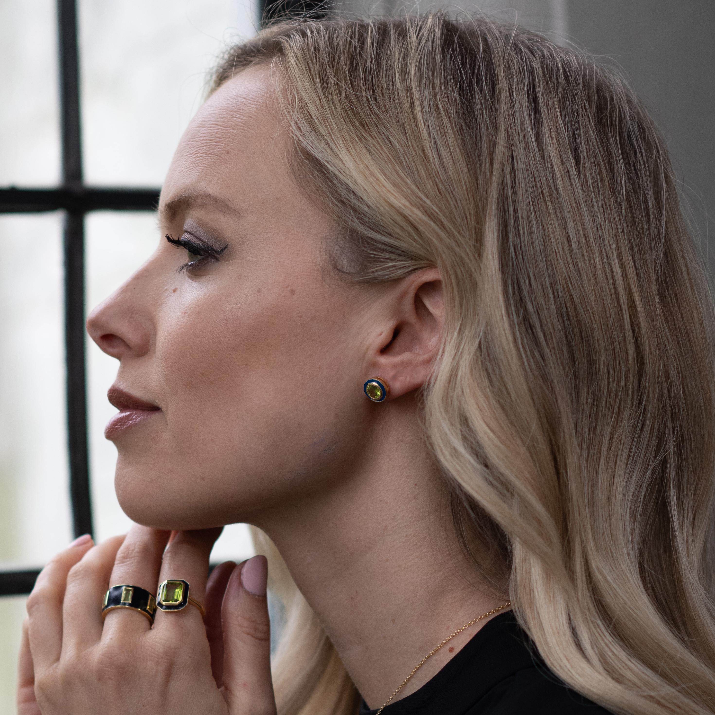 Our Stunning Peridot and Navy Enamel Studs are so bright and full of colour. The combination of the Blue and Green embodies the Northern Lights in such an elegant and unique manner. We've used Peridot in our previous collections and felt it was the