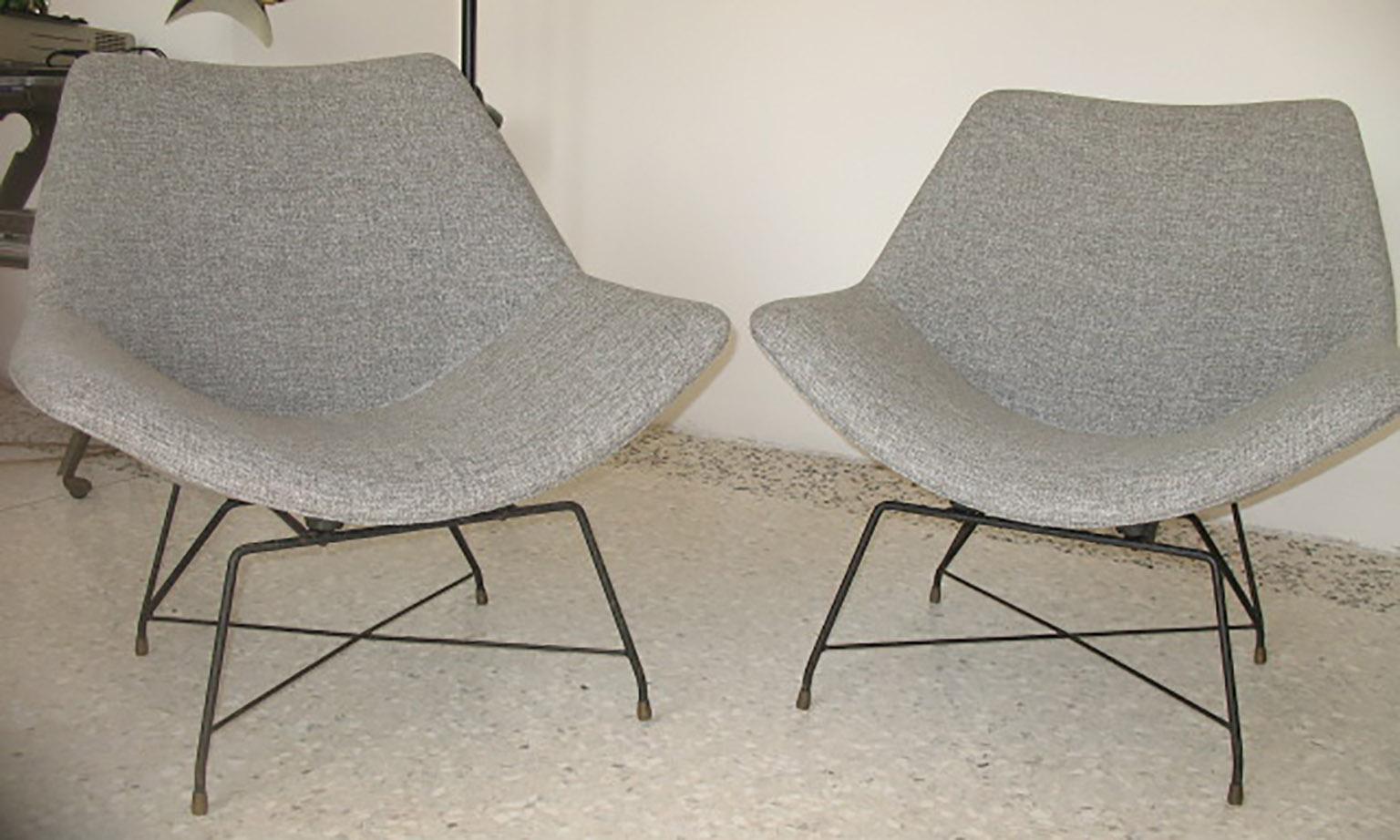 Armchairs with structure in lacquered iron and new fabric. designed By Augusto Bozzi for Saporiti in the 1950s.

Original label on the frame.