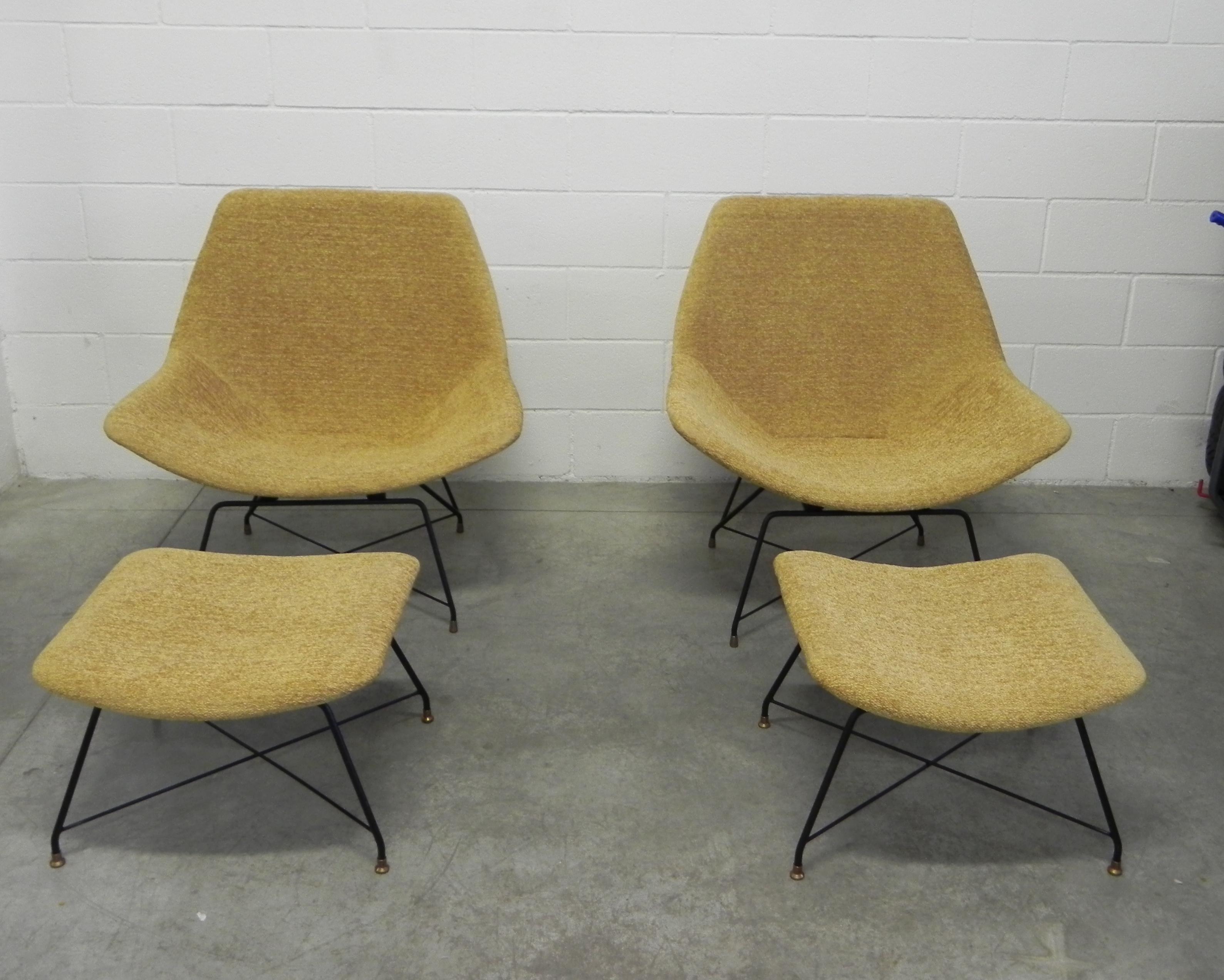 Rare pair of lounge chairs whit ottoman designed by Augusto Bozzi for Saporiti Italia, Italy, 1954. The chairs have a black lacquered metal base with solid brass feet and are newly upholstered. Makers label to underside.
