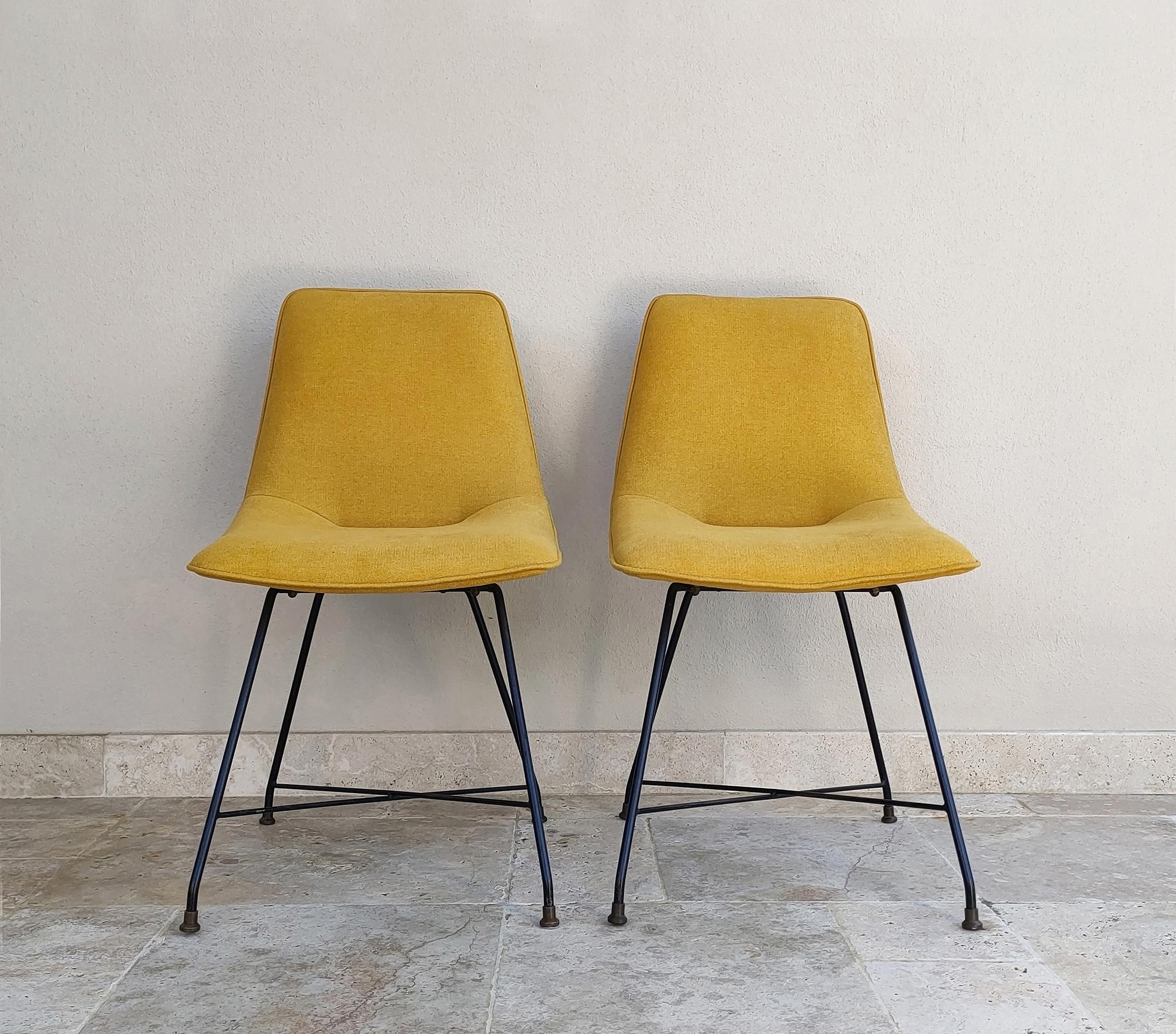 Set of two Aster chairs designed by Augusto Bozzi in the 1950s and manufactured by Fratelli Saporiti.
The main feature of chairs is the iconic and elegant metal structure of the legs, typical of the Augusto Bozzi’s design.
The chairs seats are