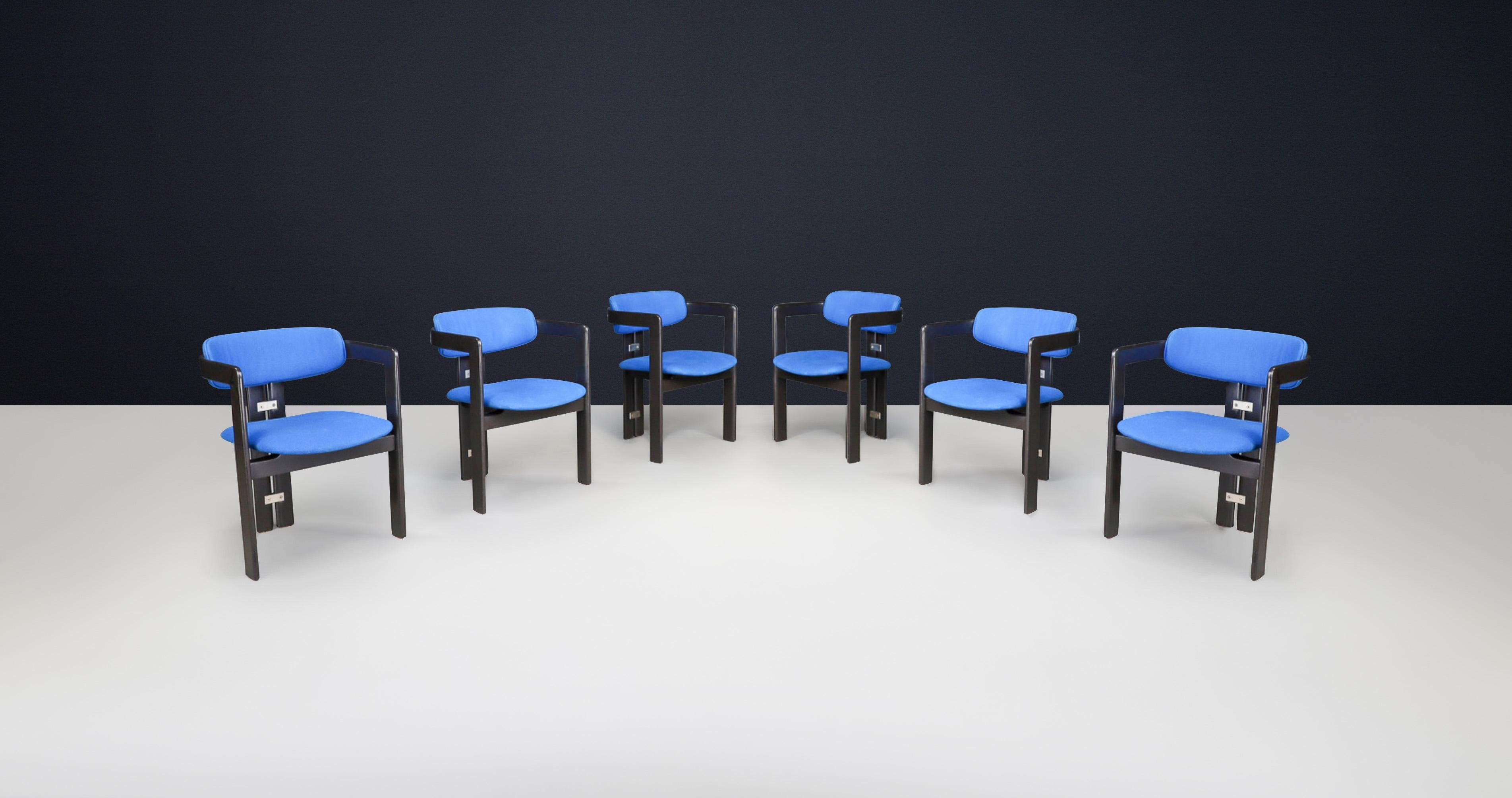 Augusto Savini for Pozzi, dining chairs, model 'Pamplona,' black lacquered ash with royal blue upholstery, Italy, 1965.

This architectural set includes six 'Pamplona' armchairs crafted from black lacquered ash and featuring original royal blue