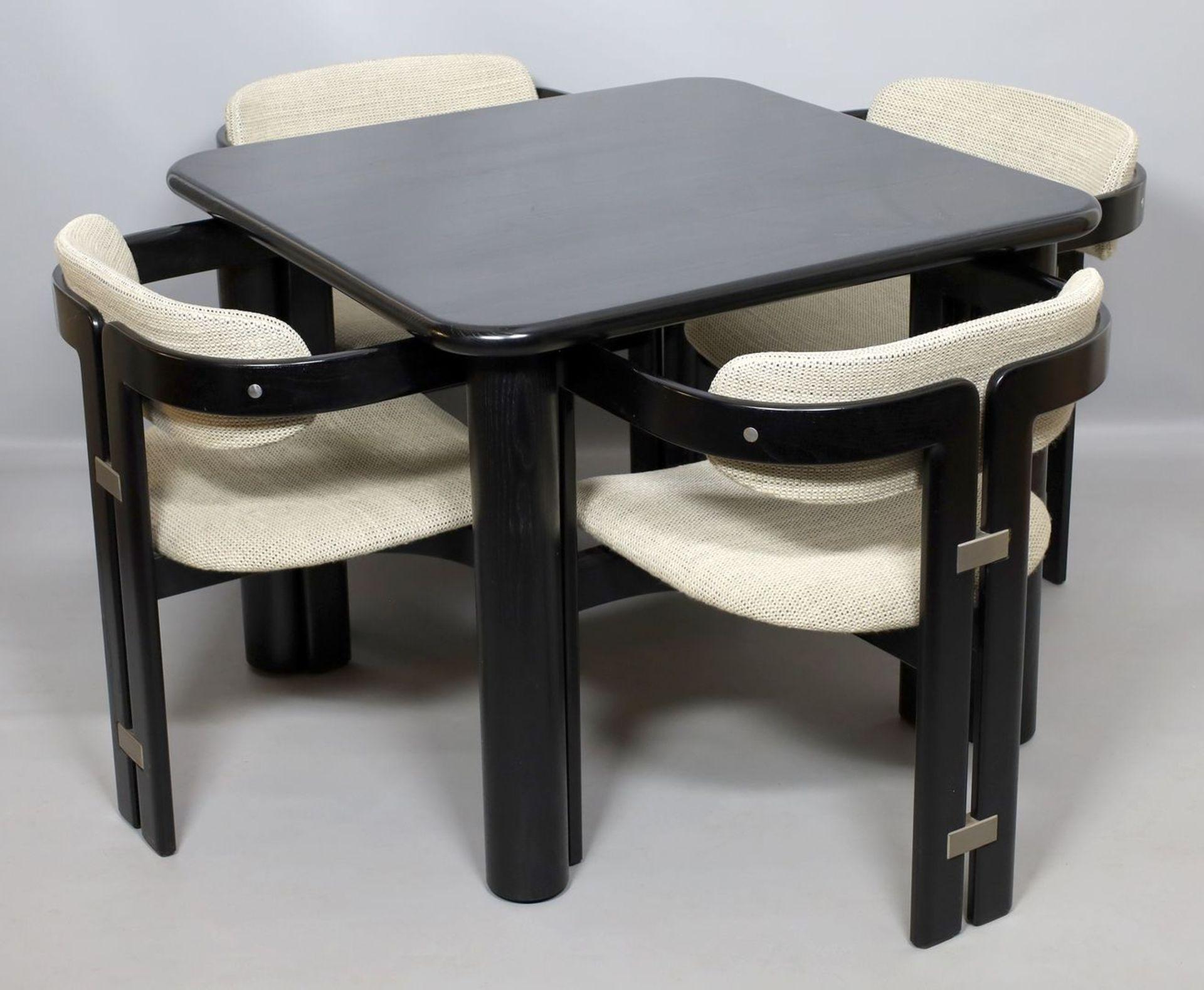 Augusto Savini for Pozzi, set of four 'Pamplona' dining chairs and table 72x 89x 89 cm., lacquered wood, Fabric upholstery, aluminum, Italy, 1965

Set of four armchairs in black lacquered wood and fabric upholstery. A characteristic design;