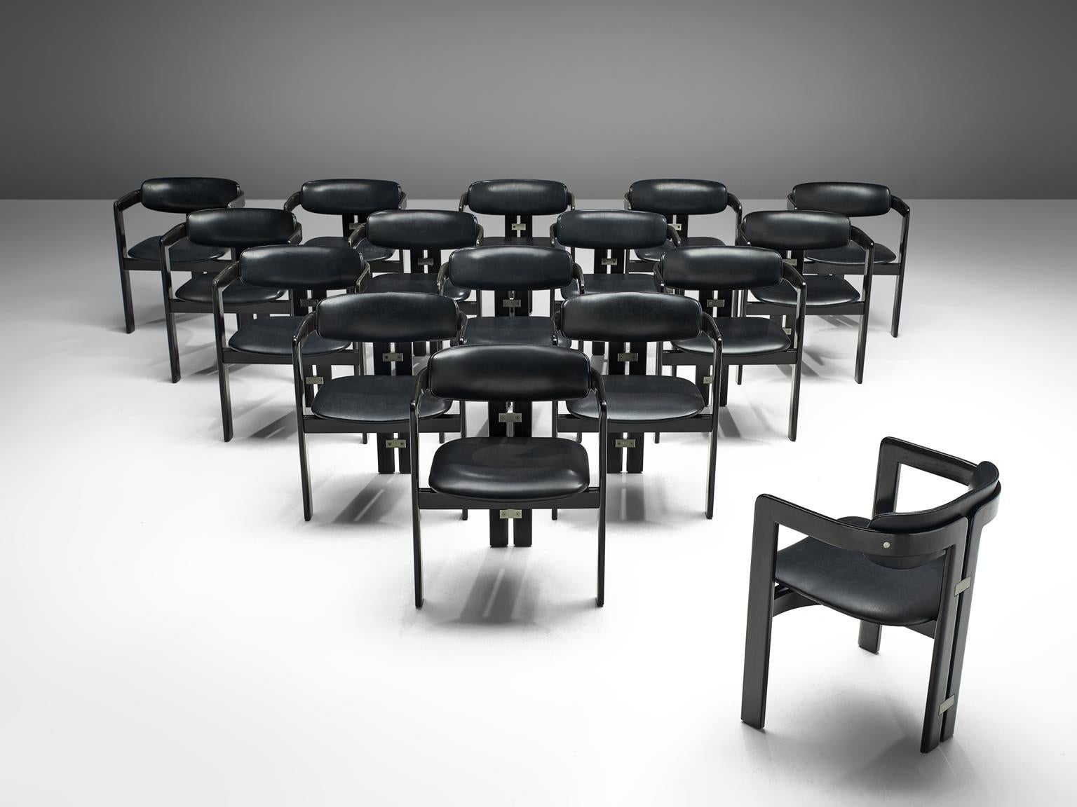 Augusto Savini for Pozzi, set of sixteen 'Pamplona' dining room chairs, in ashwood and black leather, Italy, 1965. 

This large set of Pamplona chairs is made on request in our upholstery atelier. A characteristic design; simplistic yet very strong
