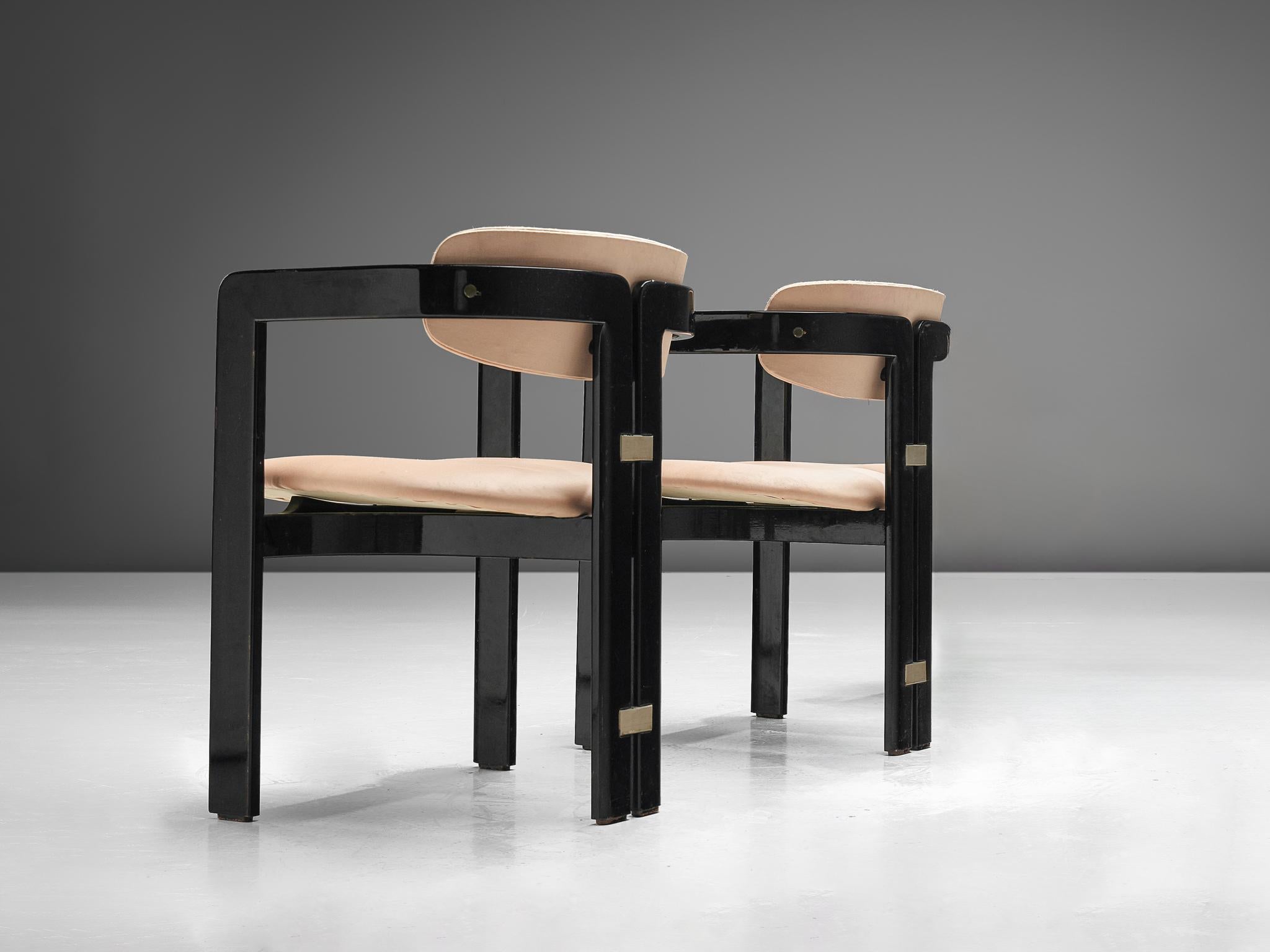 Augusto Savini for Pozzi, pair of 'Pamplona' dining room chairs , ebonized ashwood, pink fabric, Italy, design 1965

Iconic 'Pamplona' armchairs in black lacquered ash and soft pink upholstery. A characteristic design by Augusto Savini; simplistic
