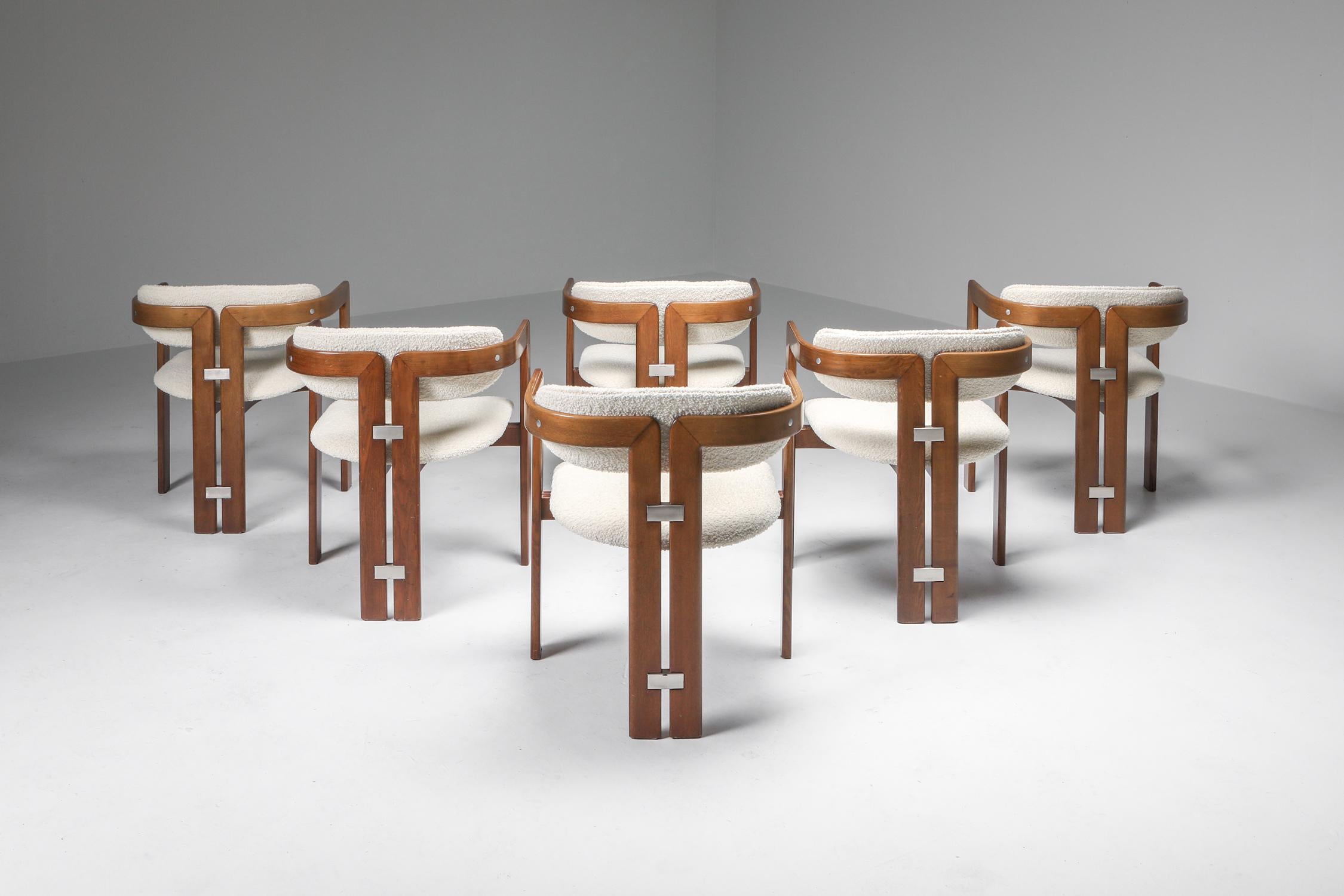 Augusto Savini, set of six 'Pamplona' dining room chairs for Pozzi, bentwood and bouclé wool, Italy, 1965. 

Set of six armchairs in rosewood and brown leather upholstery. 
These bentwood framed armchairs with aluminum elements on the back are