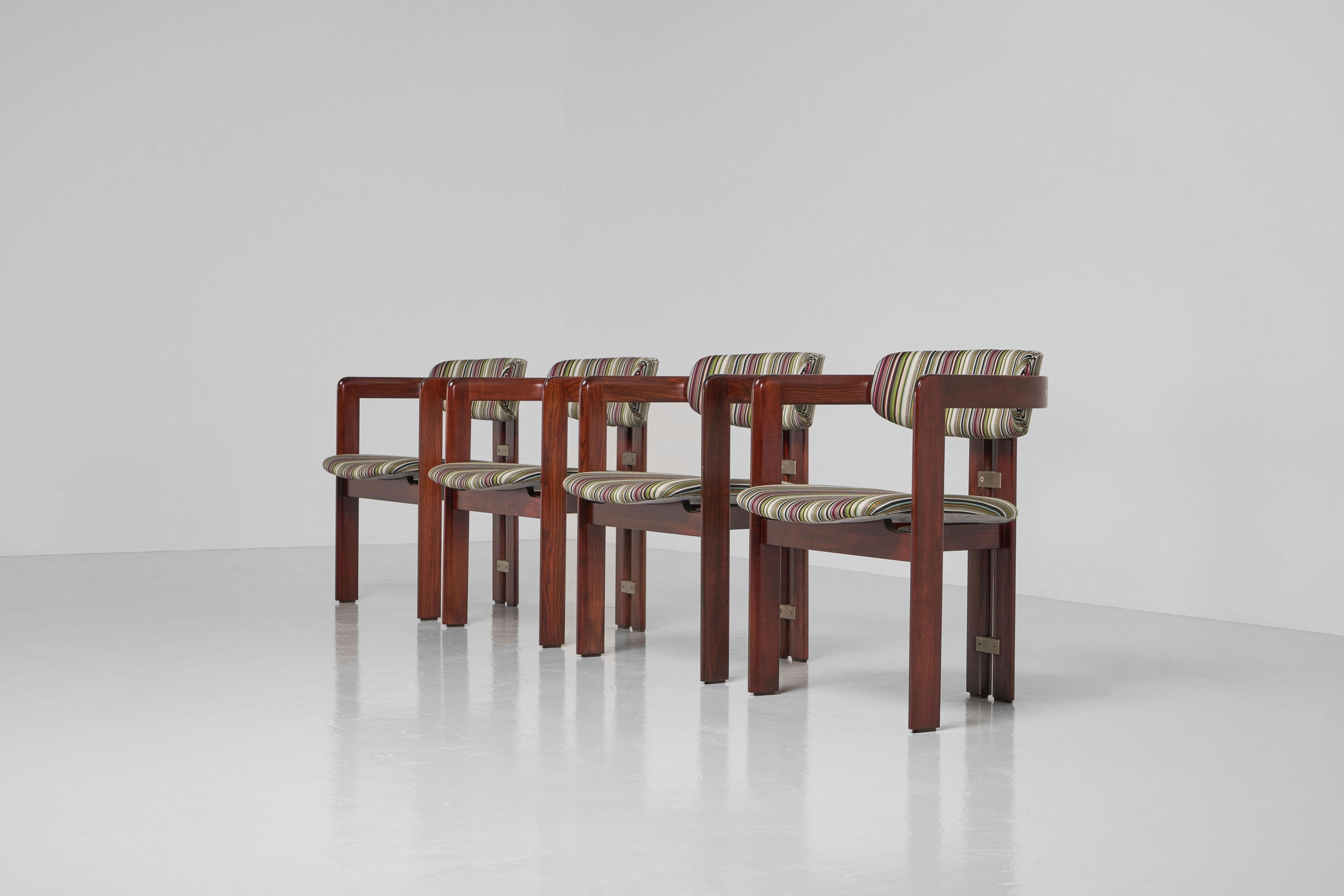 A fantastic, reupholstered set of 4 so called ‘Pamplona’ chairs designed by Augusto Savini and manufactured by Pozzi, Italy 1965. These highly elegant and comfortable dining chairs have a solid ash wooden structure which has a stained finish. It has