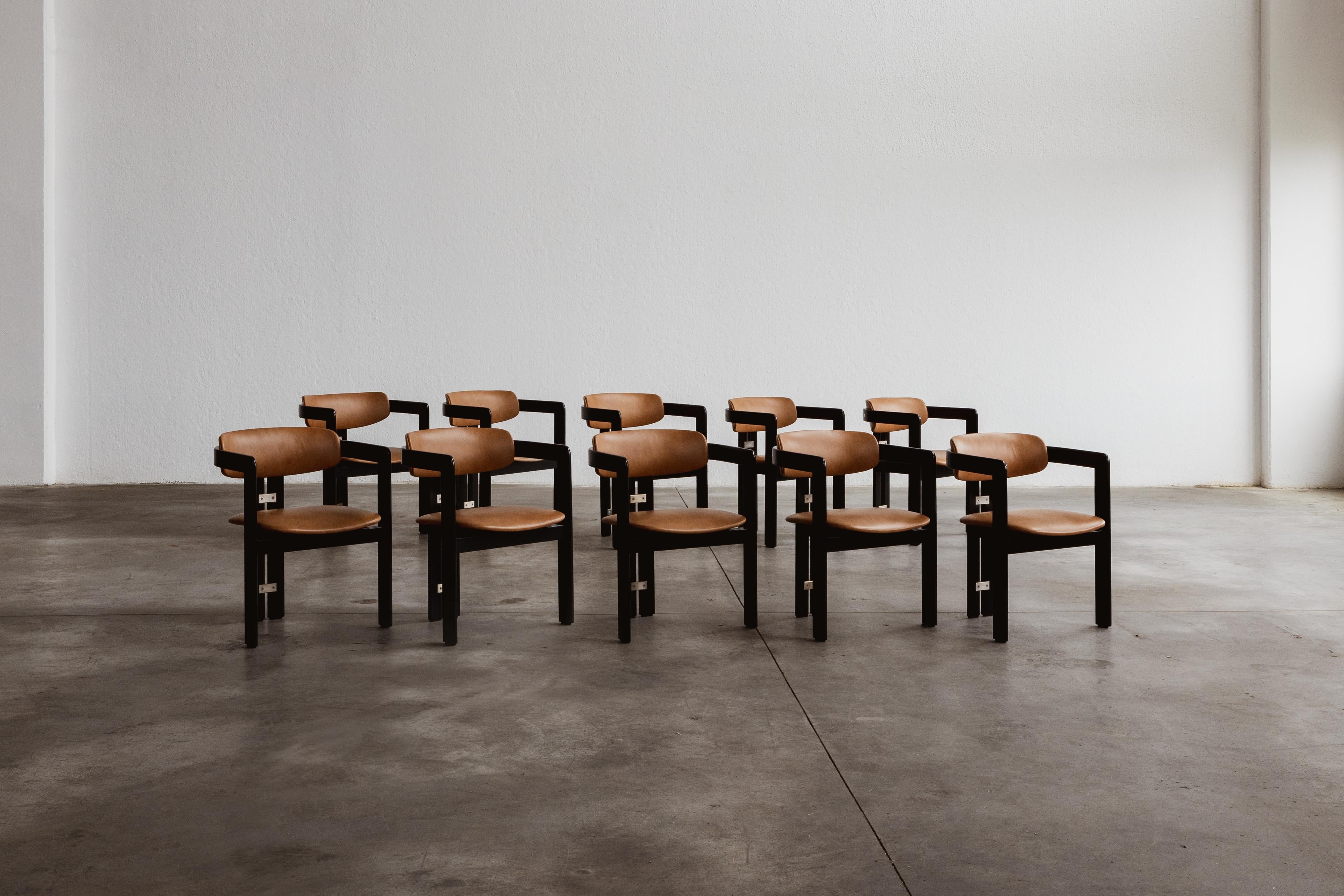 Augusto Savini “Pamplona” dining chairs for Pozzi, black framework and ranch leather, Italy, 1965, set of ten.

In the realm of Italian craftsmanship, the Pamplona chairs by Augusto Savini for Pozzi stand as a symbol of architectural elegance.