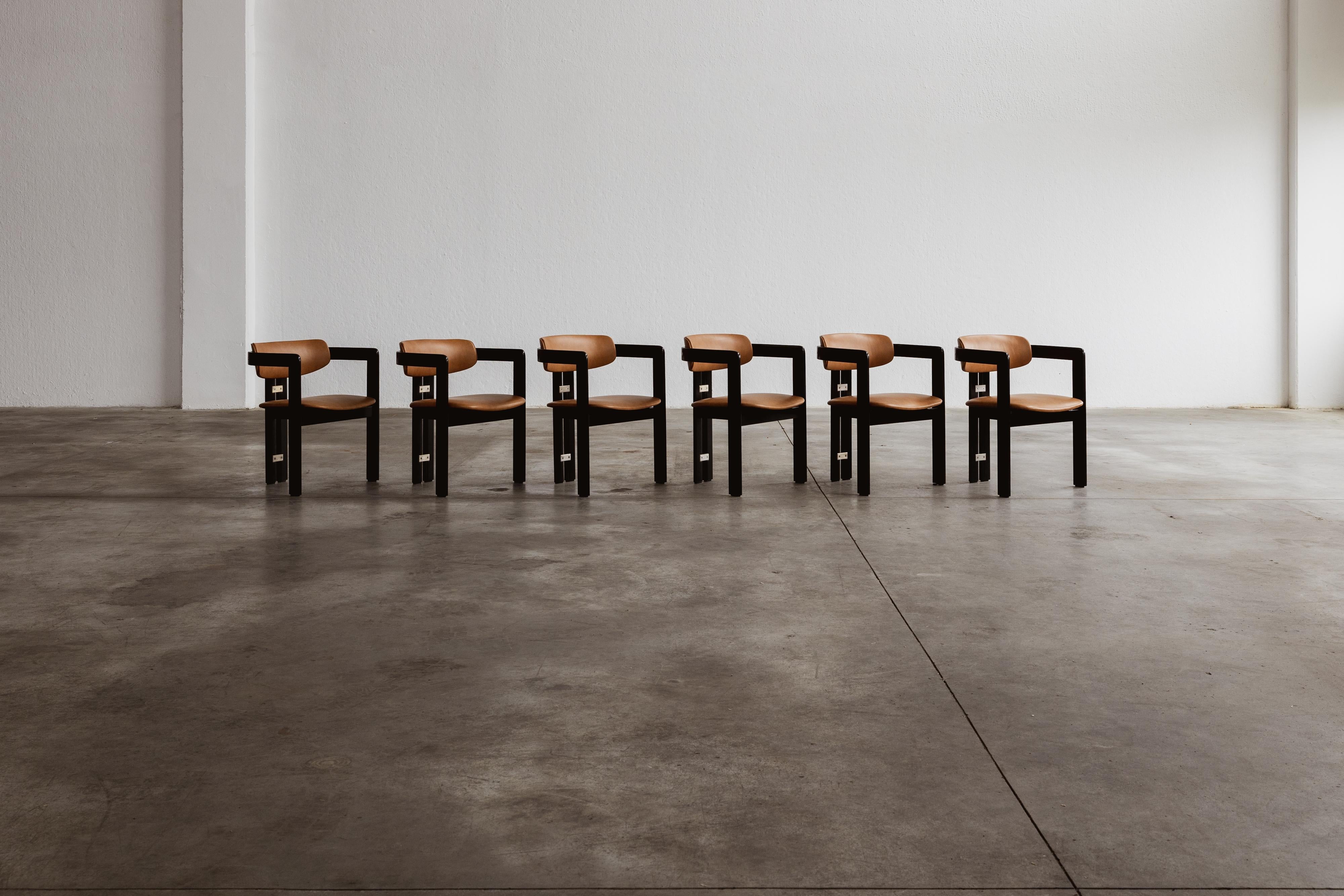 Augusto Savini “Pamplona” dining chairs for Pozzi, black framework and ranch leather, Italy, 1965, set of six.

In the realm of Italian craftsmanship, the Pamplona chairs by Augusto Savini for Pozzi stand as a symbol of architectural elegance.