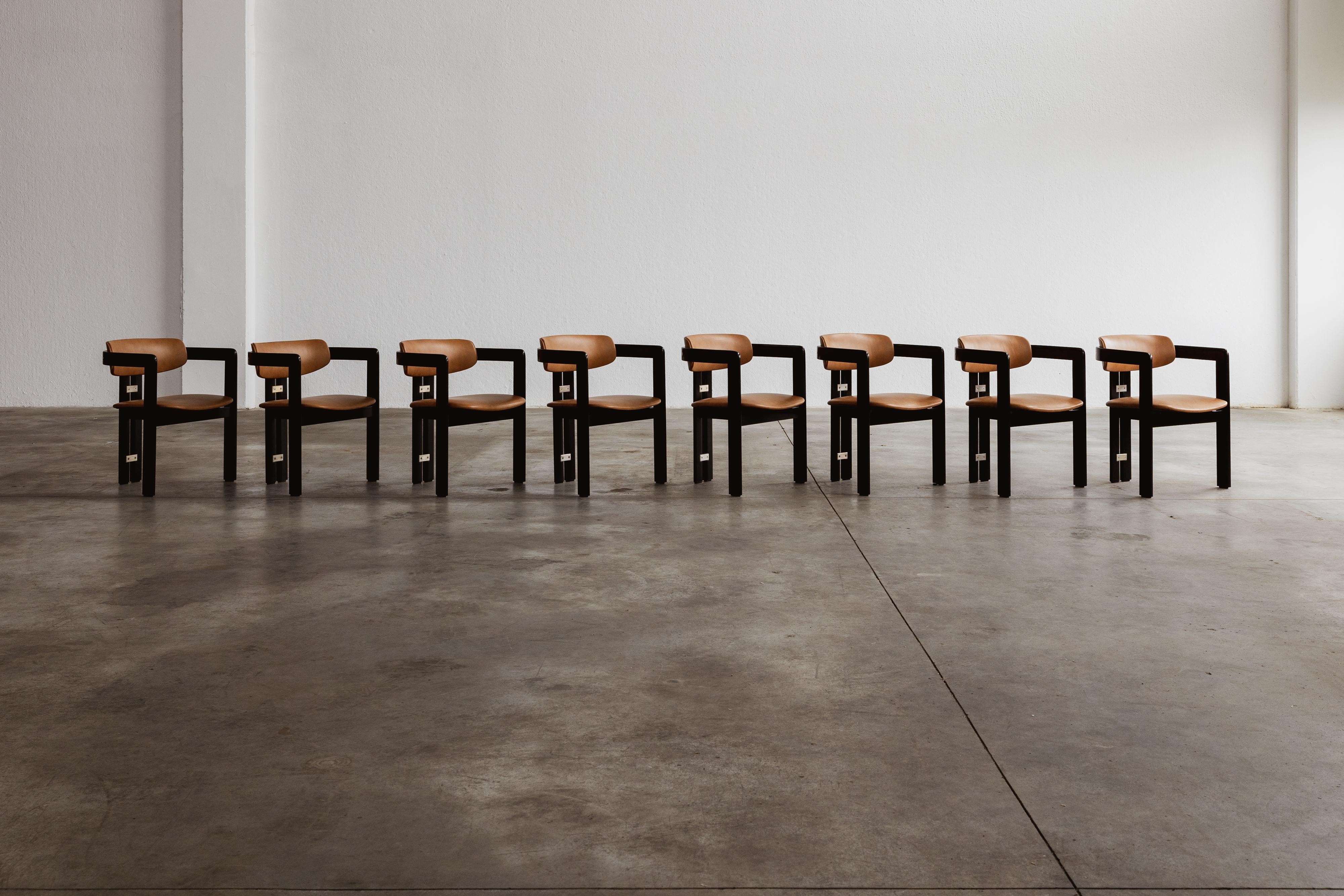 Augusto Savini “Pamplona” dining chairs for Pozzi, black framework and ranch leather, Italy, 1965, set of eight.

In the realm of Italian craftsmanship, the Pamplona chairs by Augusto Savini for Pozzi stand as a symbol of architectural elegance.