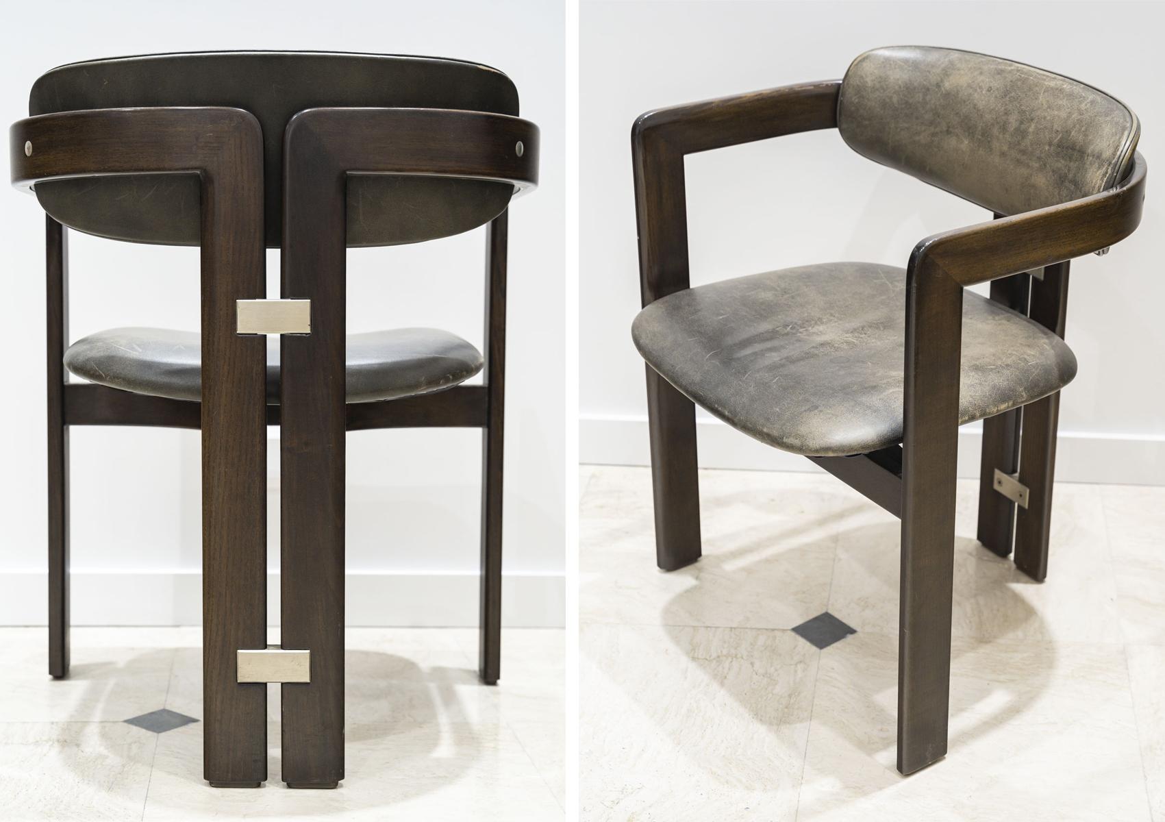 Paire de chaises Pamplona conçues par Augusto Savini en 1965.
Bois, cuir anthracite et métal. Edition Pozzi

Très bon état. Superbe patine du cuir, donnant beaucoup de caractère.

Dimensions : L 57 cm x D 51 cm x H 71 cm