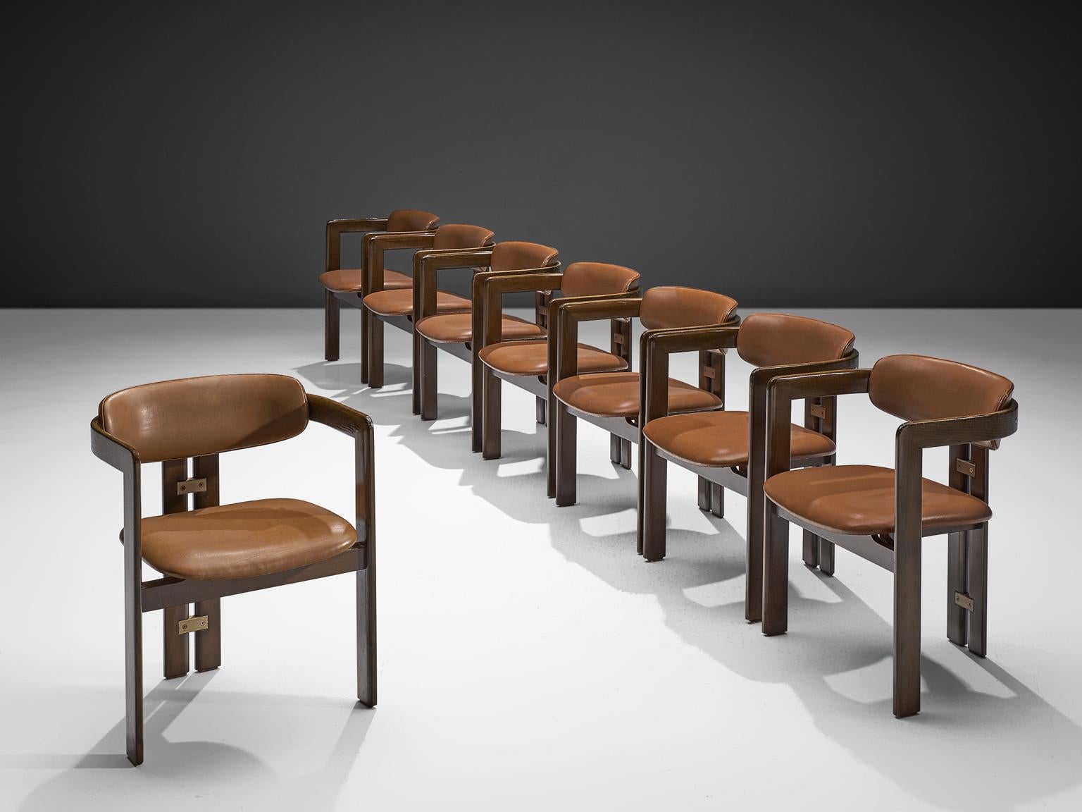 Augusto Savini for Pozzi, set of eight 'Pamplona' dining room chairs, in original cognac leather, ash and metal, Italy, 1965. 

Set of eight armchairs in ashwood and original cognac leather upholstery. The chairs have a unique and characteristic