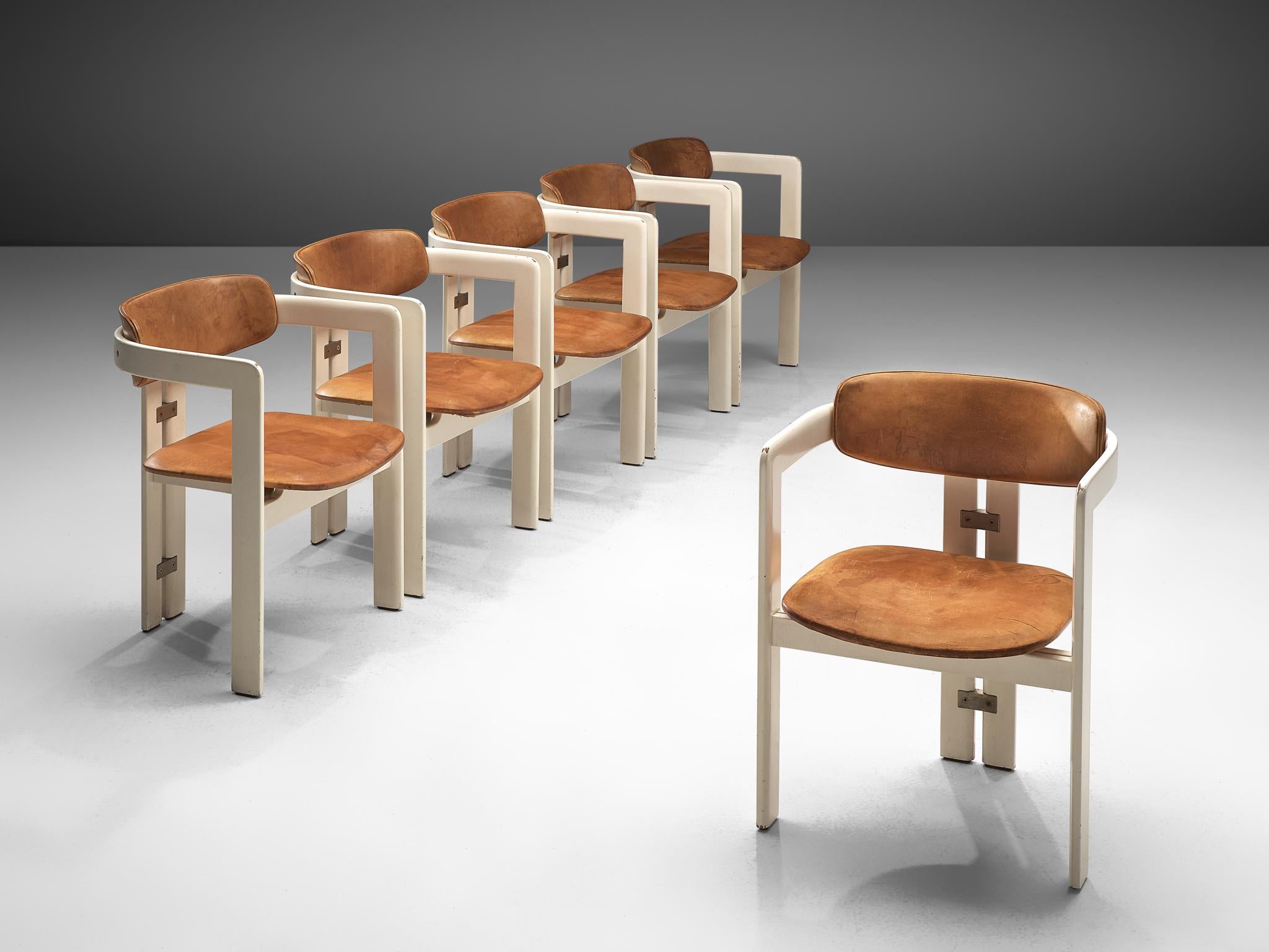 Augusto Savini for Pozzi, set of six 'Pamplona' dining room chairs, in ashwood and cognac leather, Italy, 1965.

This set of Pamplona chairs is made on request in our upholstery atelier and features egg-shell white frames in combination with