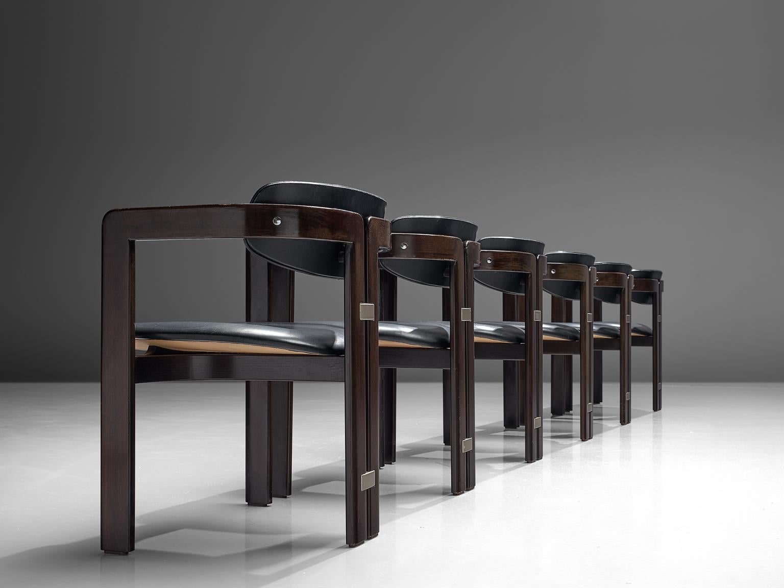 Augusto Savini for Pozzi, set of 6 ‘Pamplona’ armchairs, dark blue leather, dark brown coated wood, metal, Italy, 1960s.

Set of six armchairs in dark brown coated wood and dark blue leather. The chairs have a unique and characteristic design;