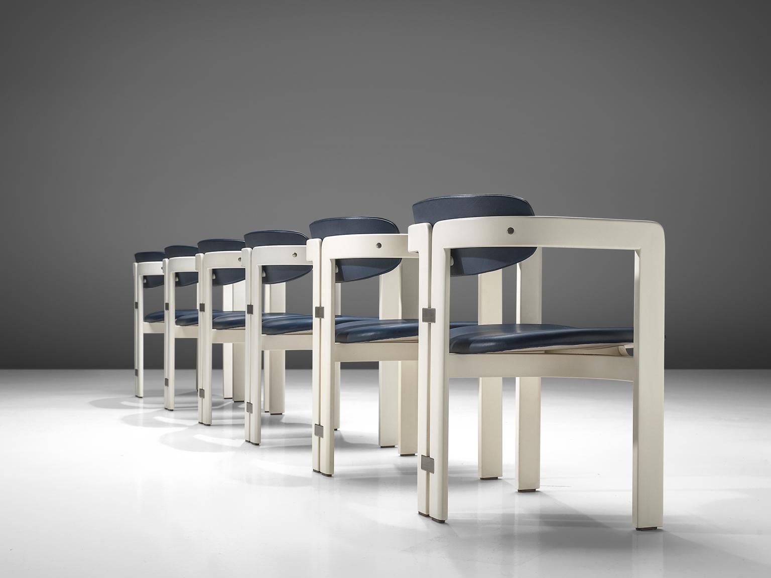 Augusto Savini for Pozzi, set of six 'Pamplona' dining room chairs, in blue leather and white coated wooden frame, Italy, 1965. 

Set of six armchairs with white frame and blue leather upholstery. A characteristic design; simplistic yet very strong