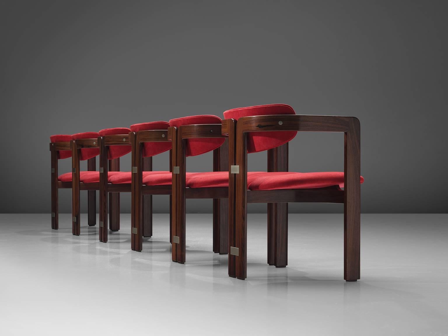 Augusto Savini, set of six 'Pamplona' dining room chairs, in rosewood and red suede, by for Pozzi, Italy, 1965. 

Set of six armchairs in rosewood and red suede upholstery. A characteristic design; simplistic yet very strong in lines and