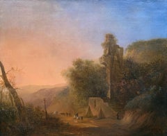 Romantic sunset landscape with ruins and travelers