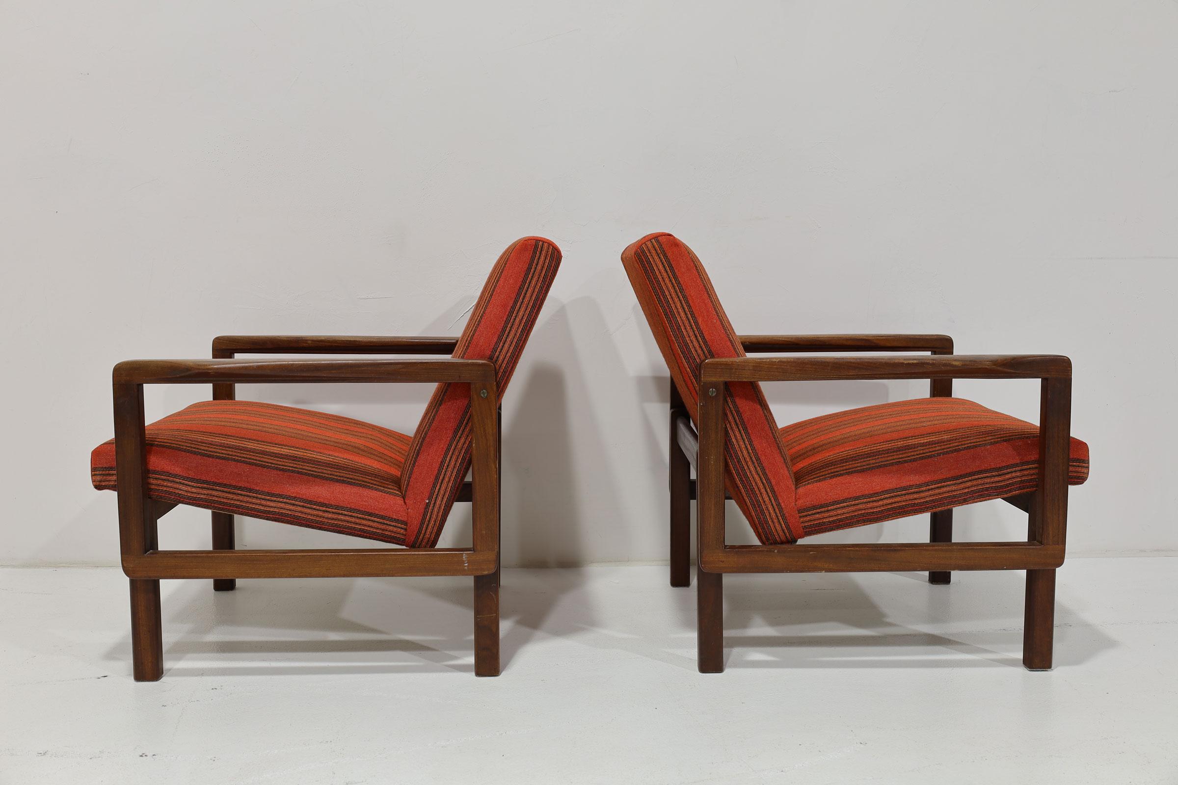 Beautiful pair of lounge chairs by Aulis Leinonen. These are teak with beautiful joinery and a handsome striped fabric that I believe is wool. A rare set. 