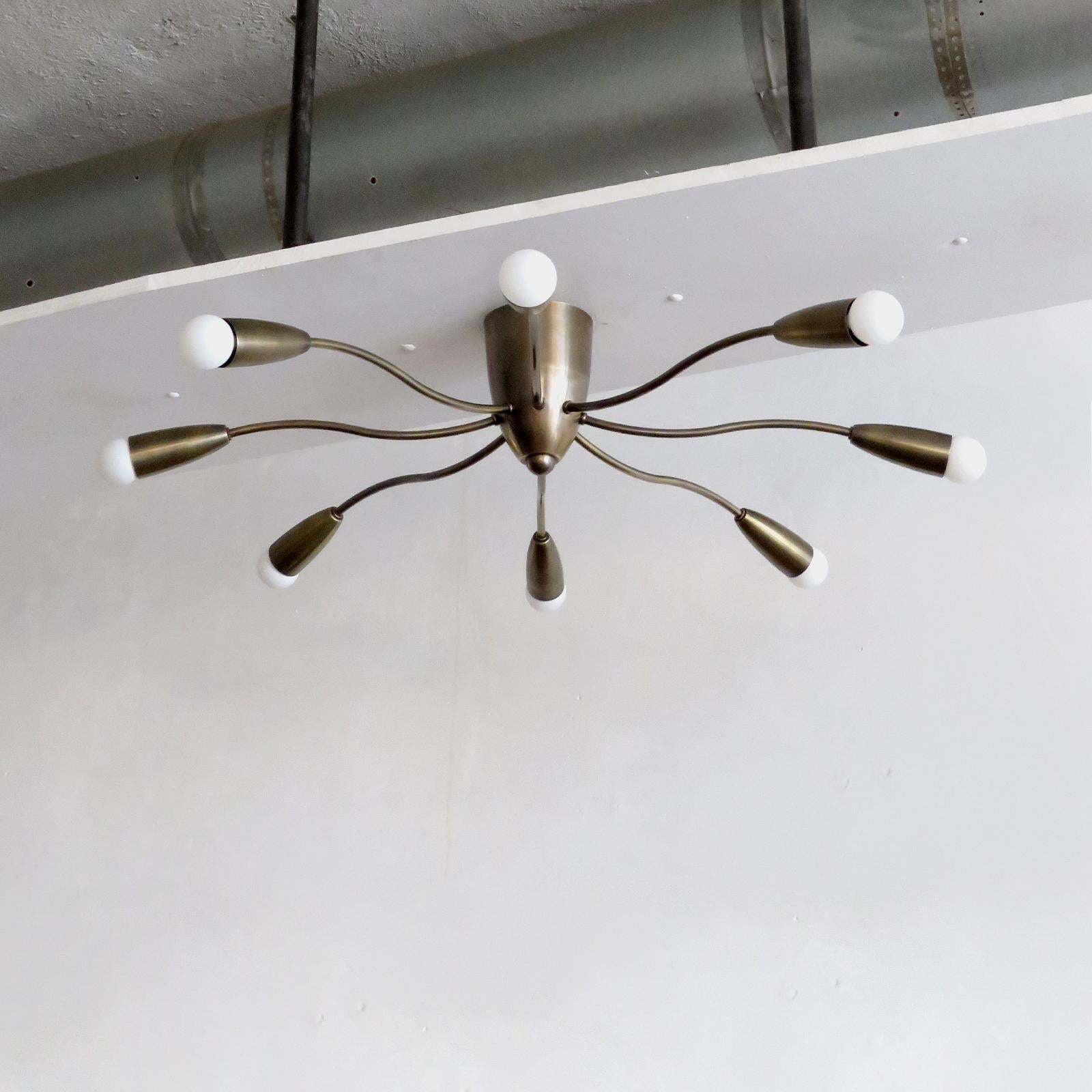 Elegant Aura-30 flushmount ceiling light in aged brass finish designed by Gallery L7, handcrafted and finished in Los Angeles from American brass. Eight E12 sockets per fixture, max. wattage 25w each, wired for US standards or European standards
