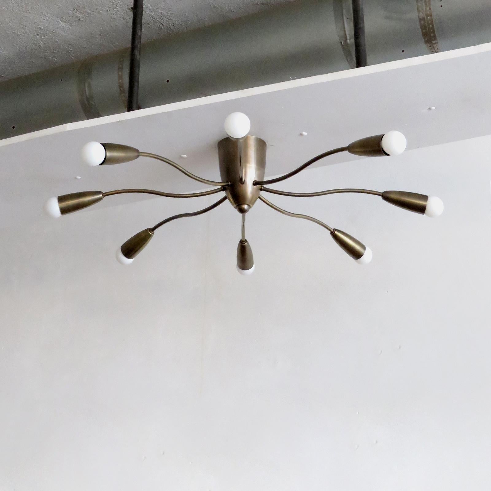 Elegant Aura-30 flush mount ceiling light in aged brass finish designed by Gallery L7, handcrafted and finished in Los Angeles from American brass. Eight E12 sockets per fixture, max. wattage 40w each or 3-7w LED equivalent, wired for US standards