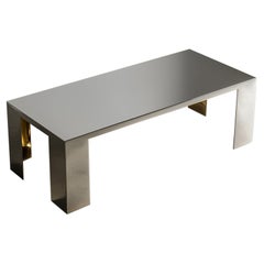 Mesa de comedor «Aura», de acero inoxidable pulido y latón, de Slash Objects