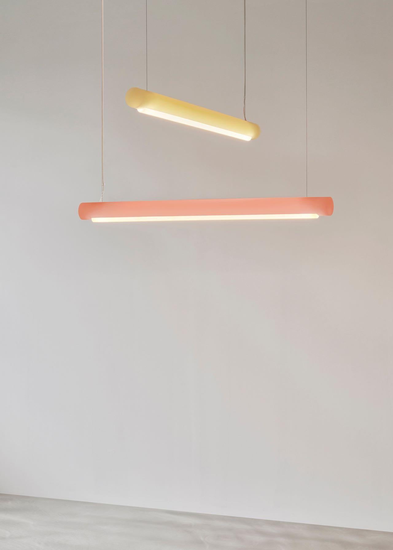 Harnessing Marcelis’ expertise in colour, the suspended cylinder bar of the Aura Light can stand alone or work as part of a grouping. Over a metre in length, the design is made from a bio-epoxy resin, created using by-products from farming.
A