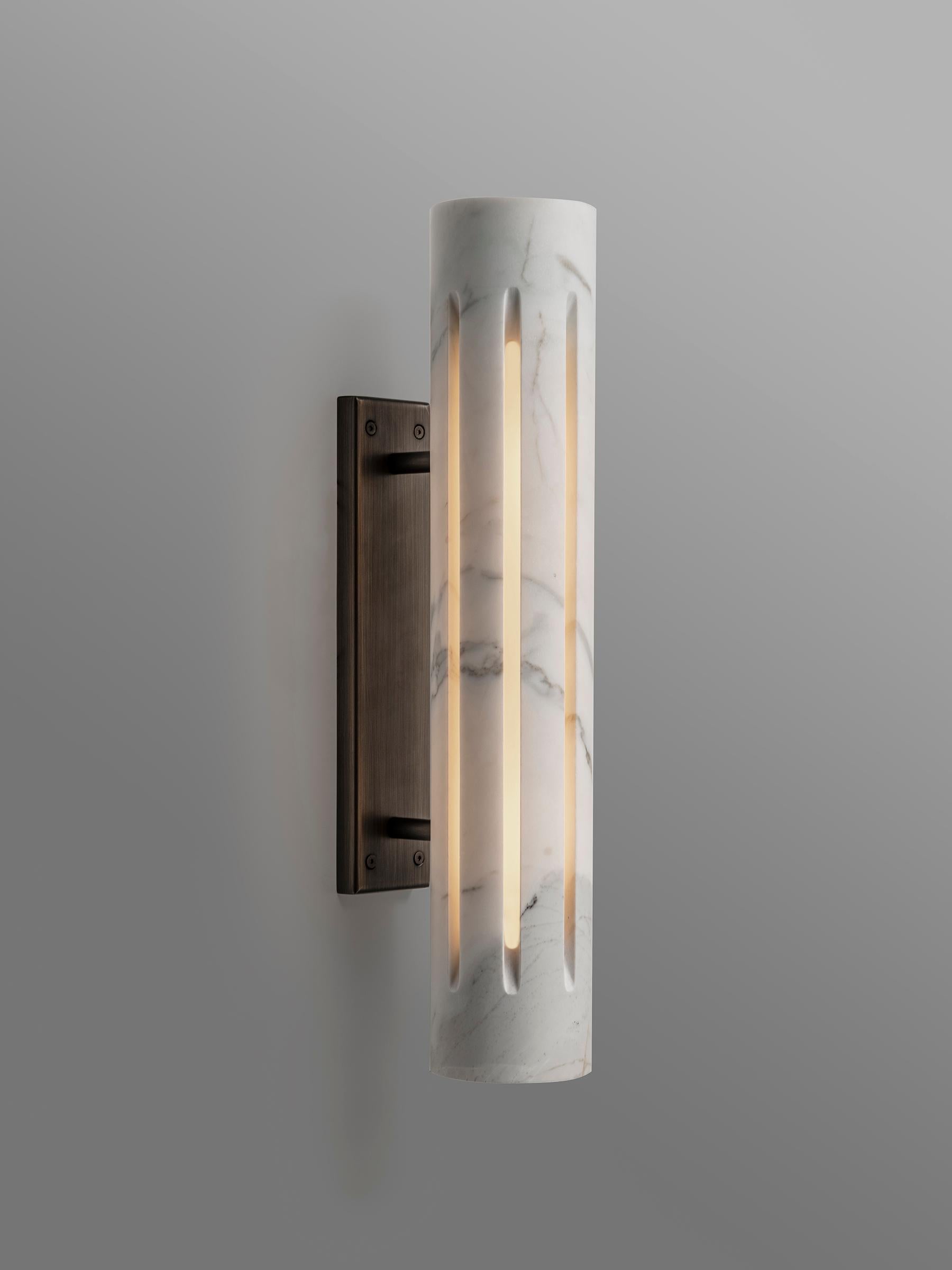 Aura Marble Lantern Sconce by Etamorph
Dimensions: Ø 50 x D 10 cm.
Materials: Calacata Marble and Black Matter stone.

All our lamps can be wired according to each country. If sold to the USA it will be wired for the USA for instance. Please contact